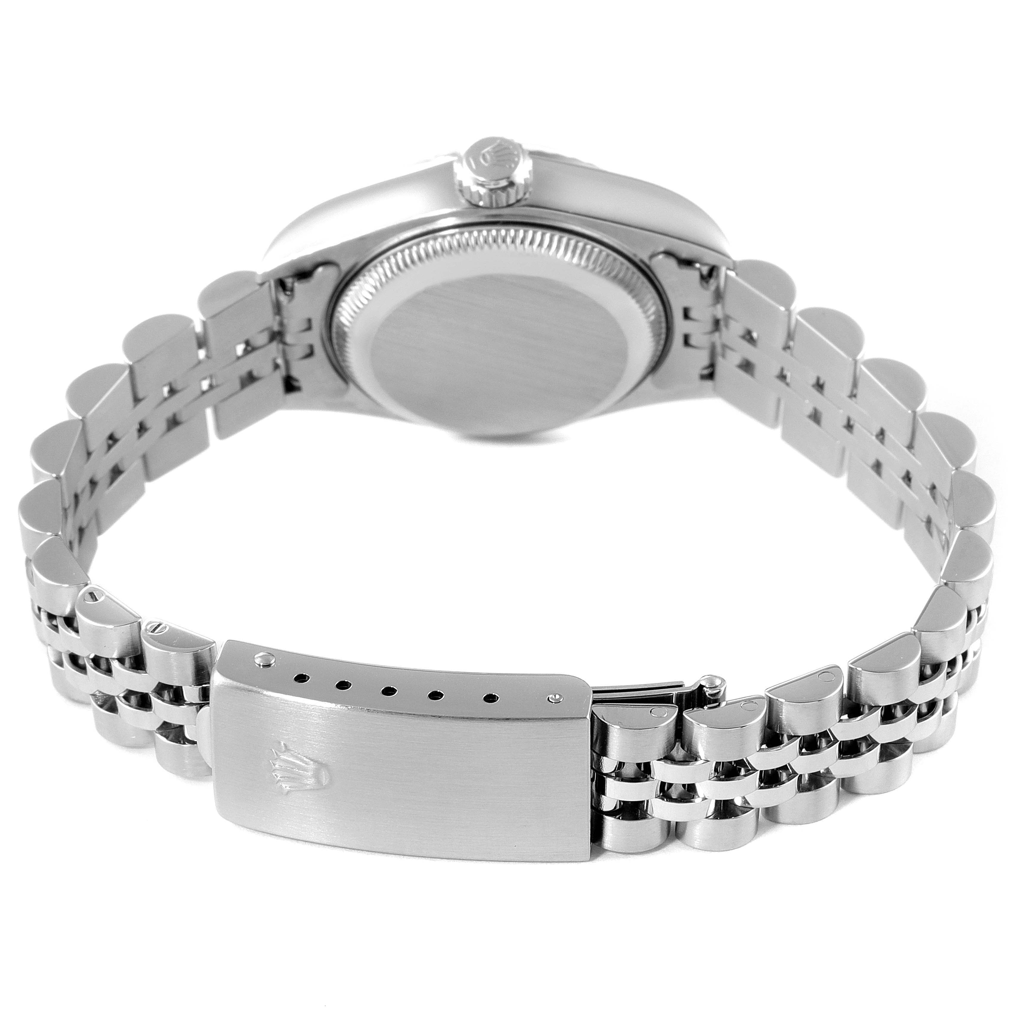 This Rolex Datejust 79174 Women's Stainless Steel Black Dial 79174 Women's Stainless Steel Black Dial watch is shown from the back, highlighting its clasp, case back, and bracelet.