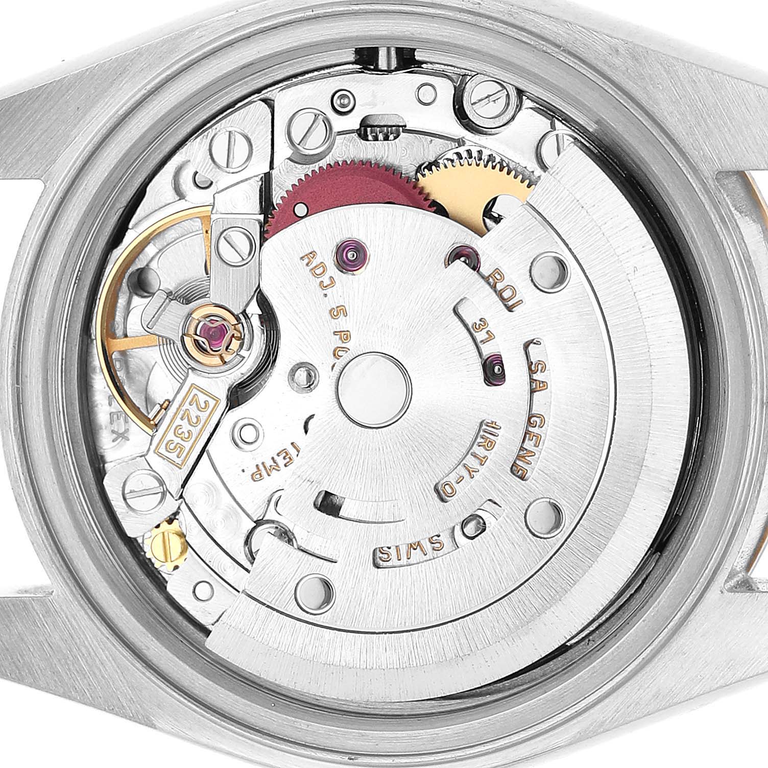 The image shows the internal movement of a Rolex Datejust 79173 Women's Steel and Gold (two tone) Black Dial watch from a top-down angle, highlighting gears and components.