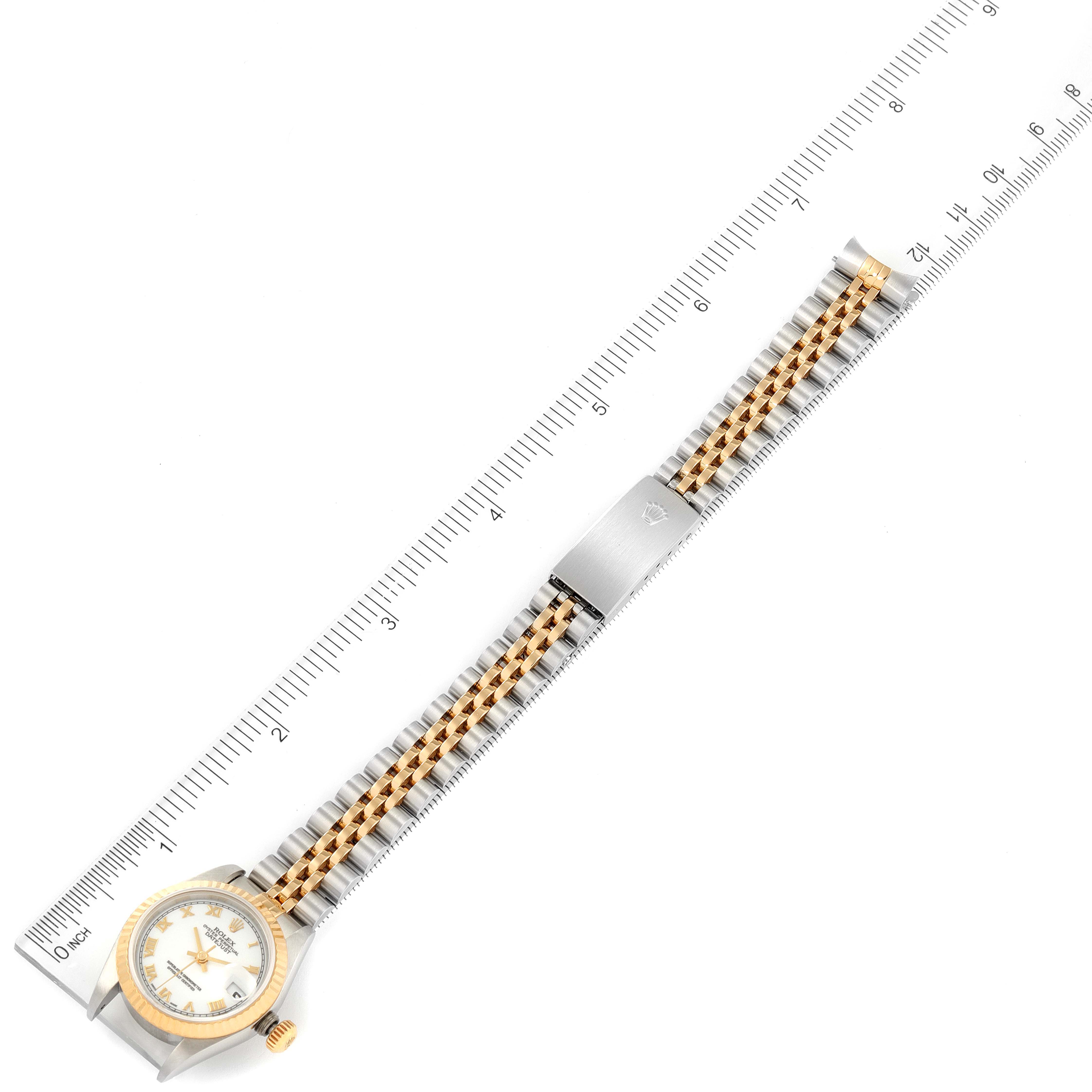 The image shows a top-down view of a Rolex Datejust 79173 Women's Steel and Gold (two tone) White Dial 79173 Women's Steel and Gold (two tone) White Dial watch, highlighting the face, bezel, bracelet, and clasp.