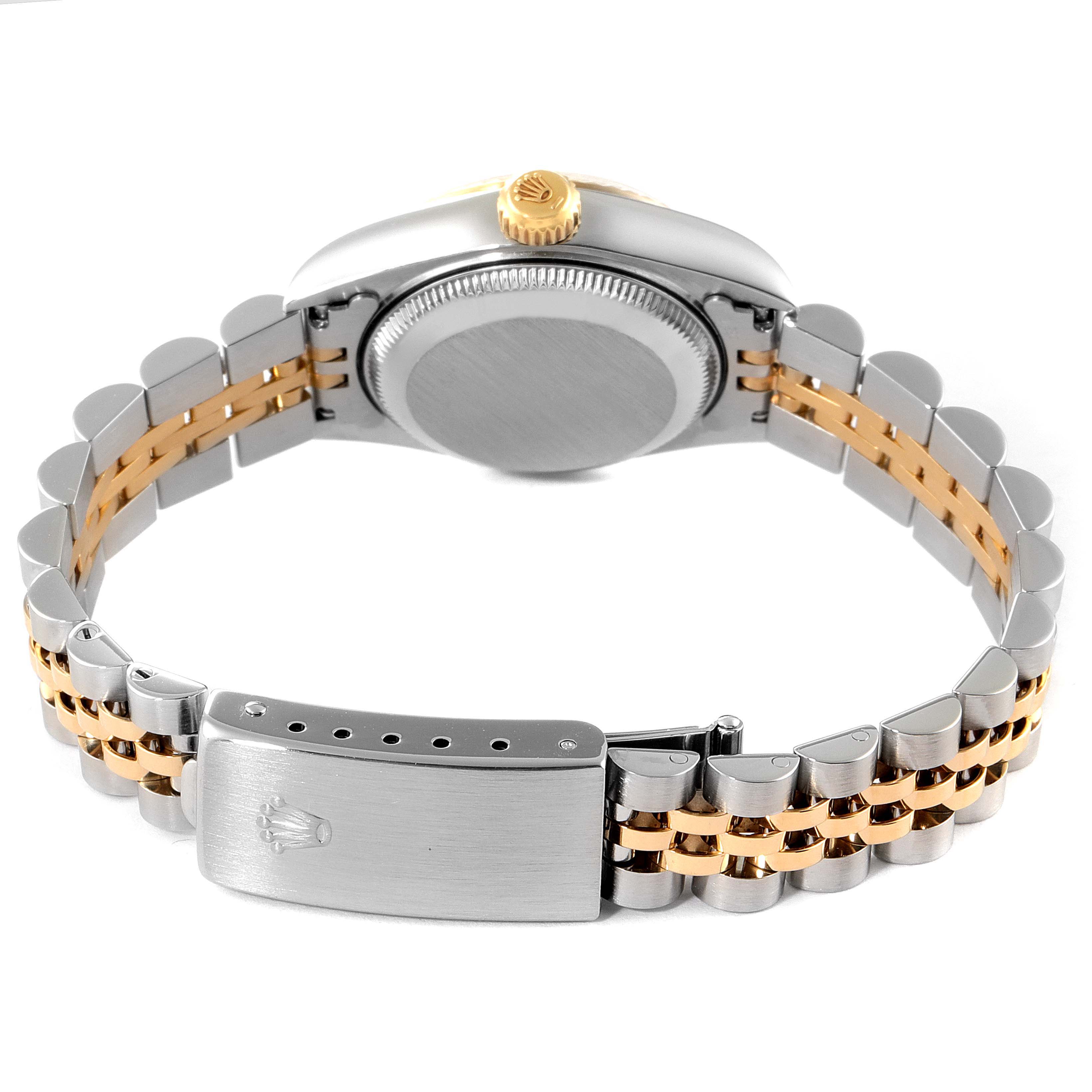 This image shows the back view of a Rolex Datejust 79173 Women's Steel and Gold (two tone) White Dial 79173 Women's Steel and Gold (two tone) White Dial watch, highlighting its case back, crown, and two-tone bracelet with a clasp.
