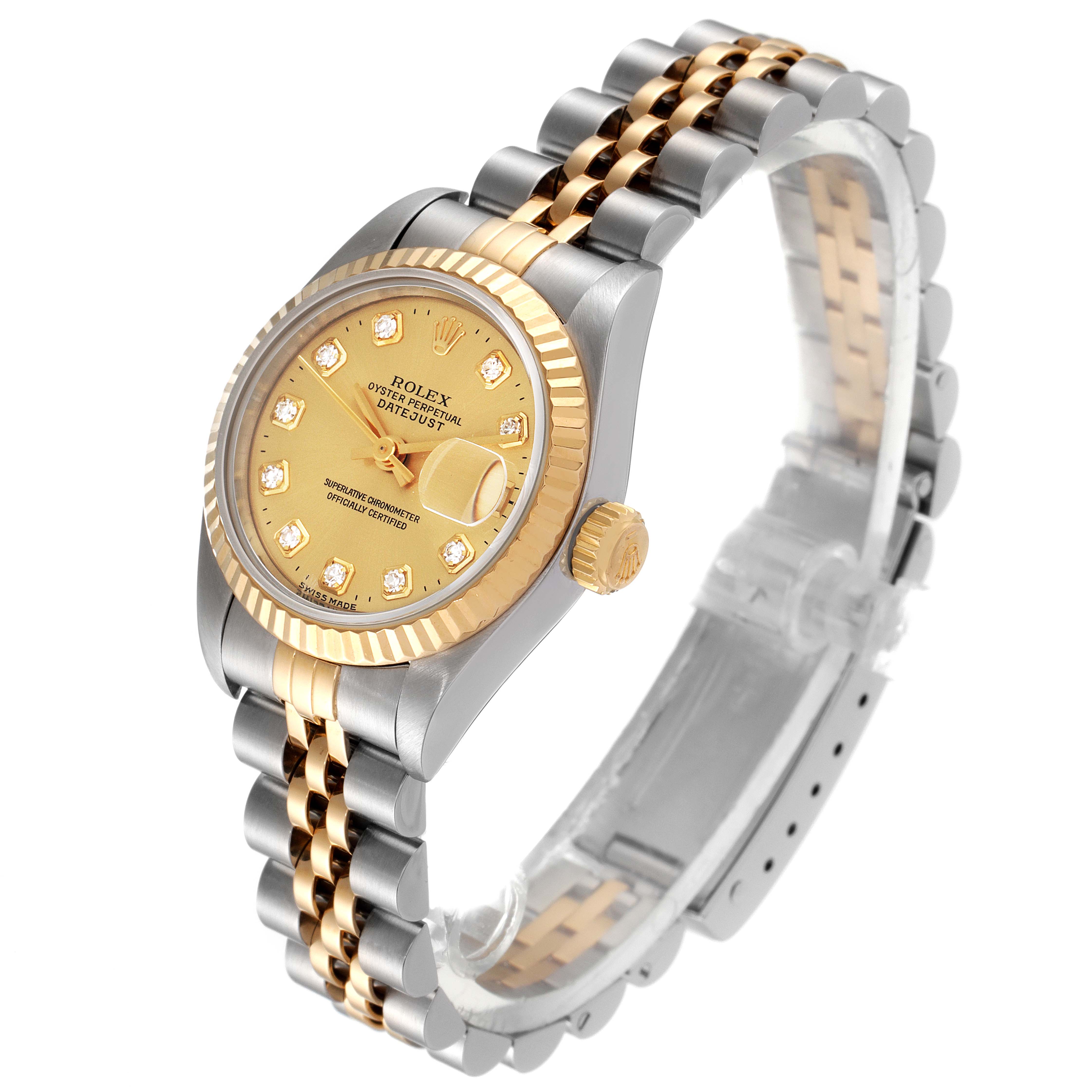 The Rolex Datejust 69173 Women
s Steel and Gold (two tone) Champagne Dial 69173 Women
s Steel and Gold (two tone) Champagne Dial watch is shown at a slight angle, displaying its two-tone bracelet, fluted bezel, and diamond-set dial.