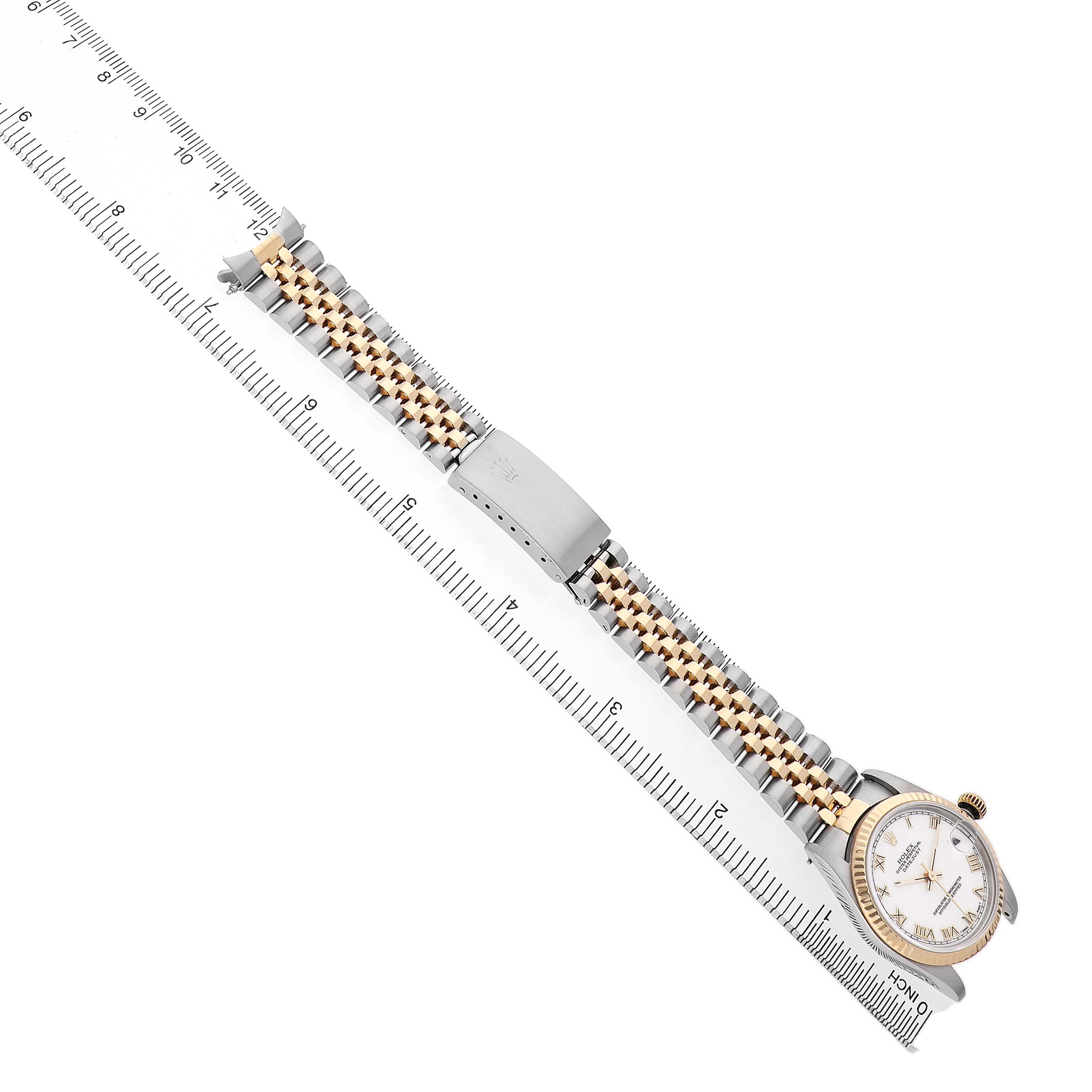 The Rolex Datejust 68273 Women's Steel and Gold (two tone) White Dial watch is shown from a top-down angle, highlighting its bracelet and clasp.
