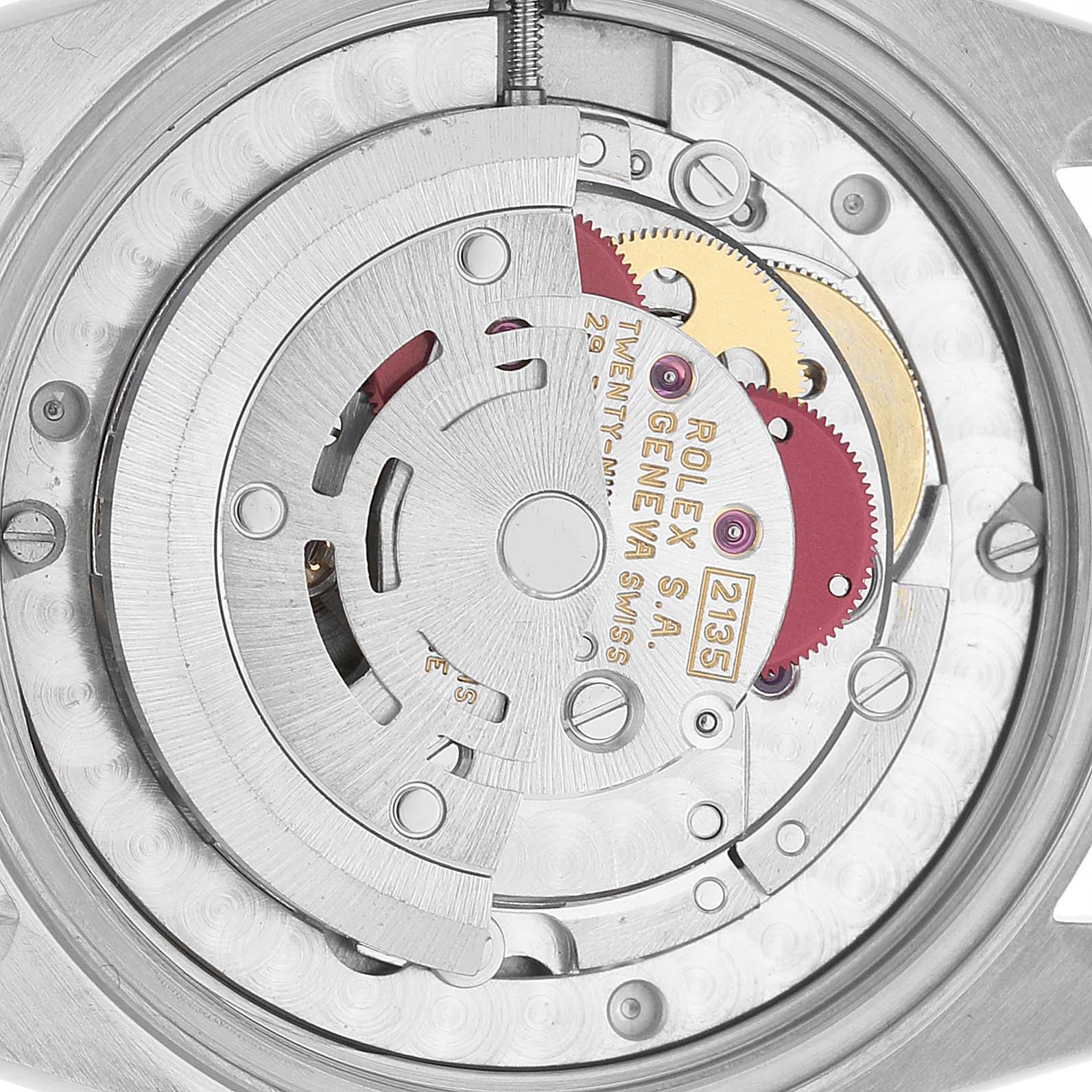 The image shows a close-up of the Rolex Datejust 68273 Women's Steel and Gold (two tone) White Dial movement, highlighting gears and the rotor.