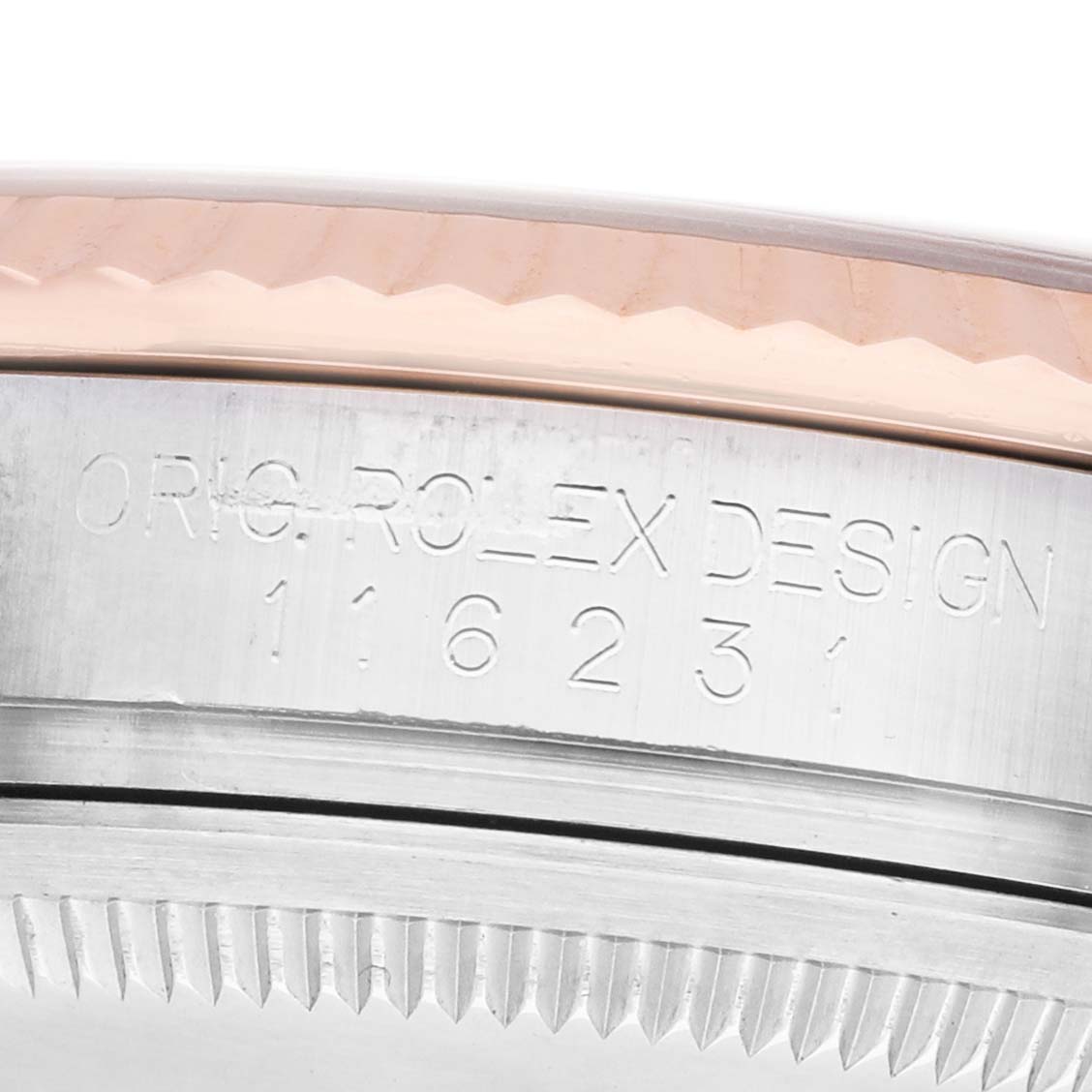 The image shows a close-up of the side of a Rolex Datejust 116231 Men's Steel and Gold (two tone) White Dial, featuring the model number and design engraving.