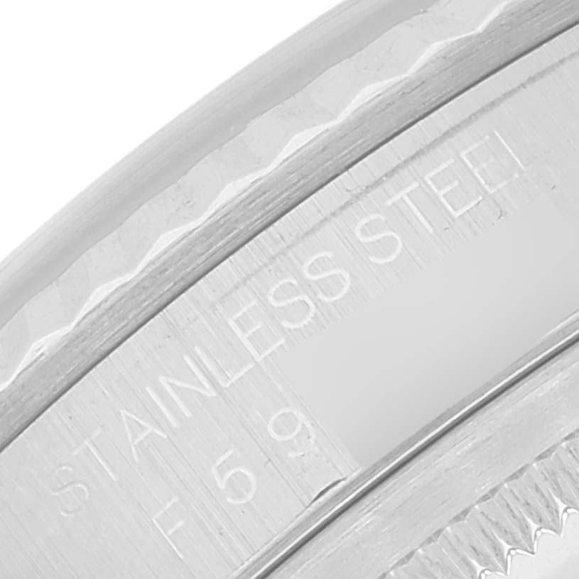 This close-up image shows the engraving of "STAINLESS STEEL" on the inner rim of a Rolex Datejust 16234 Men's Stainless Steel Silver Dial 16234 Men's Stainless Steel Silver Dial watch.