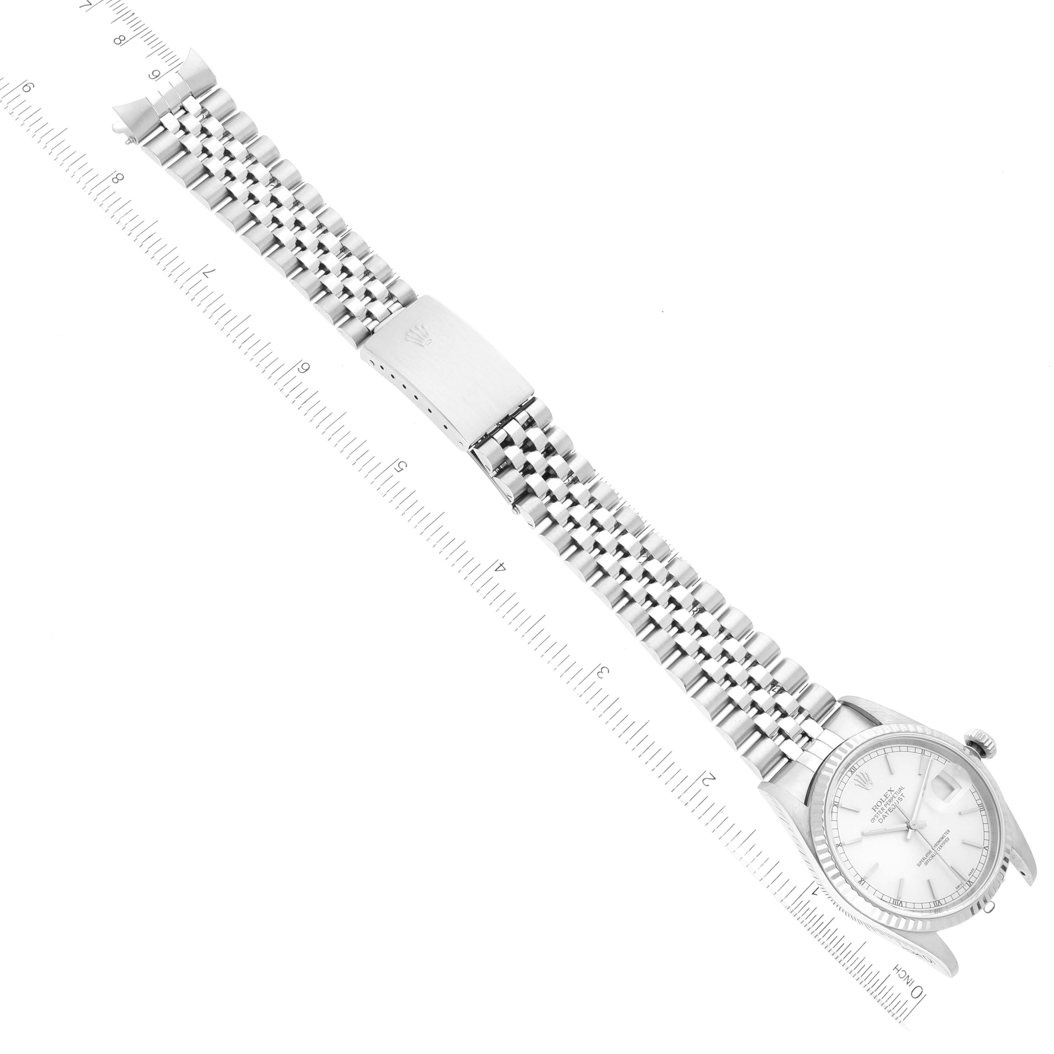 The image shows a top view of a Rolex Datejust 16234 Men's Stainless Steel Silver Dial 16234 Men's Stainless Steel Silver Dial watch, displaying the full bracelet and part of the dial, accompanied by a measuring ruler.