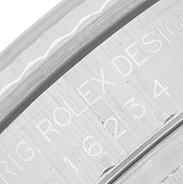 This image shows a close-up of the engraved inner bezel of a Rolex Datejust 16234 Men's Stainless Steel Silver Dial 16234 Men's Stainless Steel Silver Dial watch.