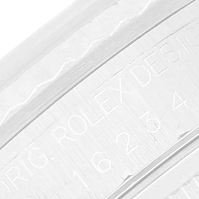This close-up shows the engraved bezel and part of the inner case of a Rolex Datejust 16234 Men's Stainless Steel Silver Dial 16234 Men's Stainless Steel Silver Dial watch.