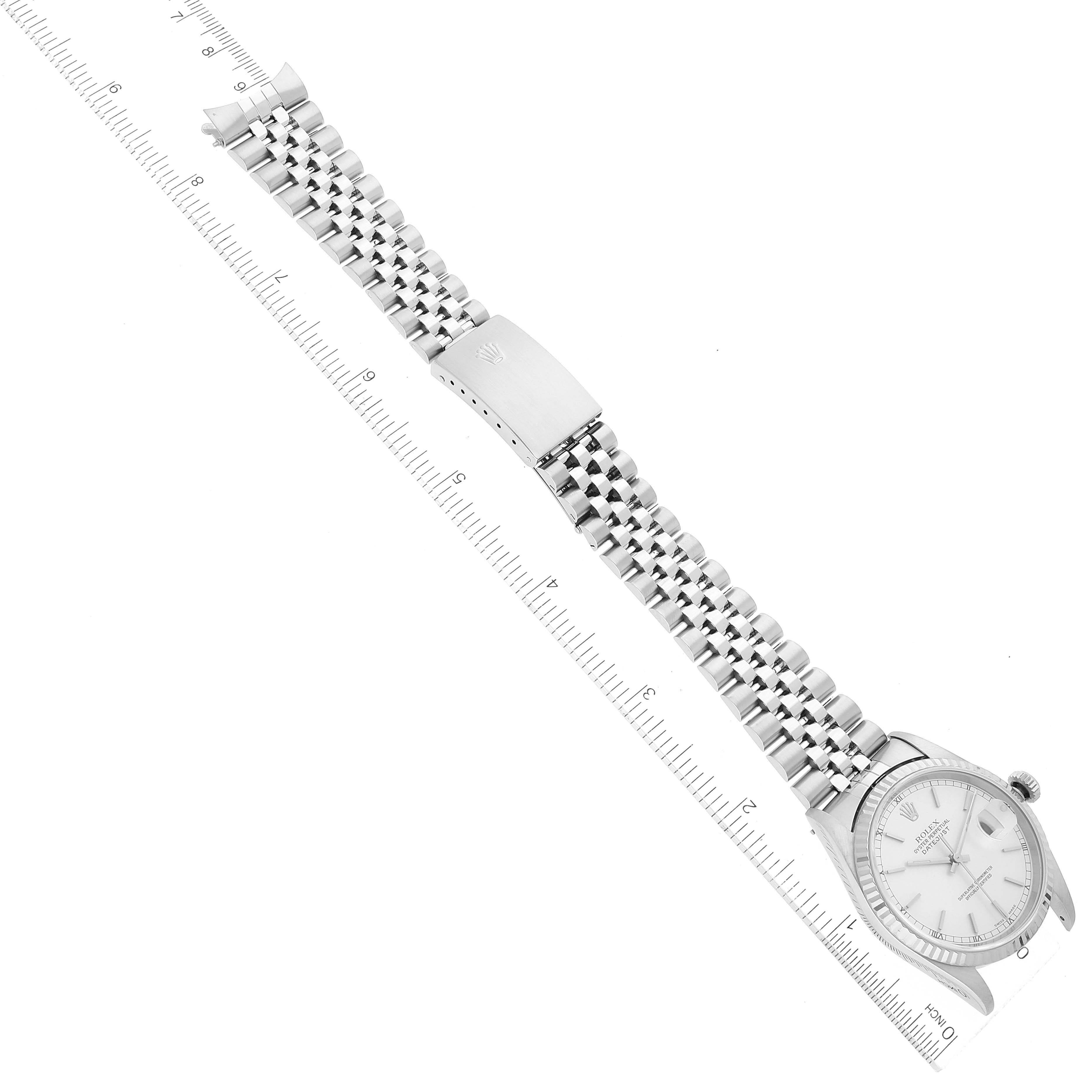 The image shows a Rolex Datejust 16234 Men's Stainless Steel Silver Dial 16234 Men's Stainless Steel Silver Dial watch laid flat with the bracelet and clasp visible, aligned with measuring rulers at both sides.