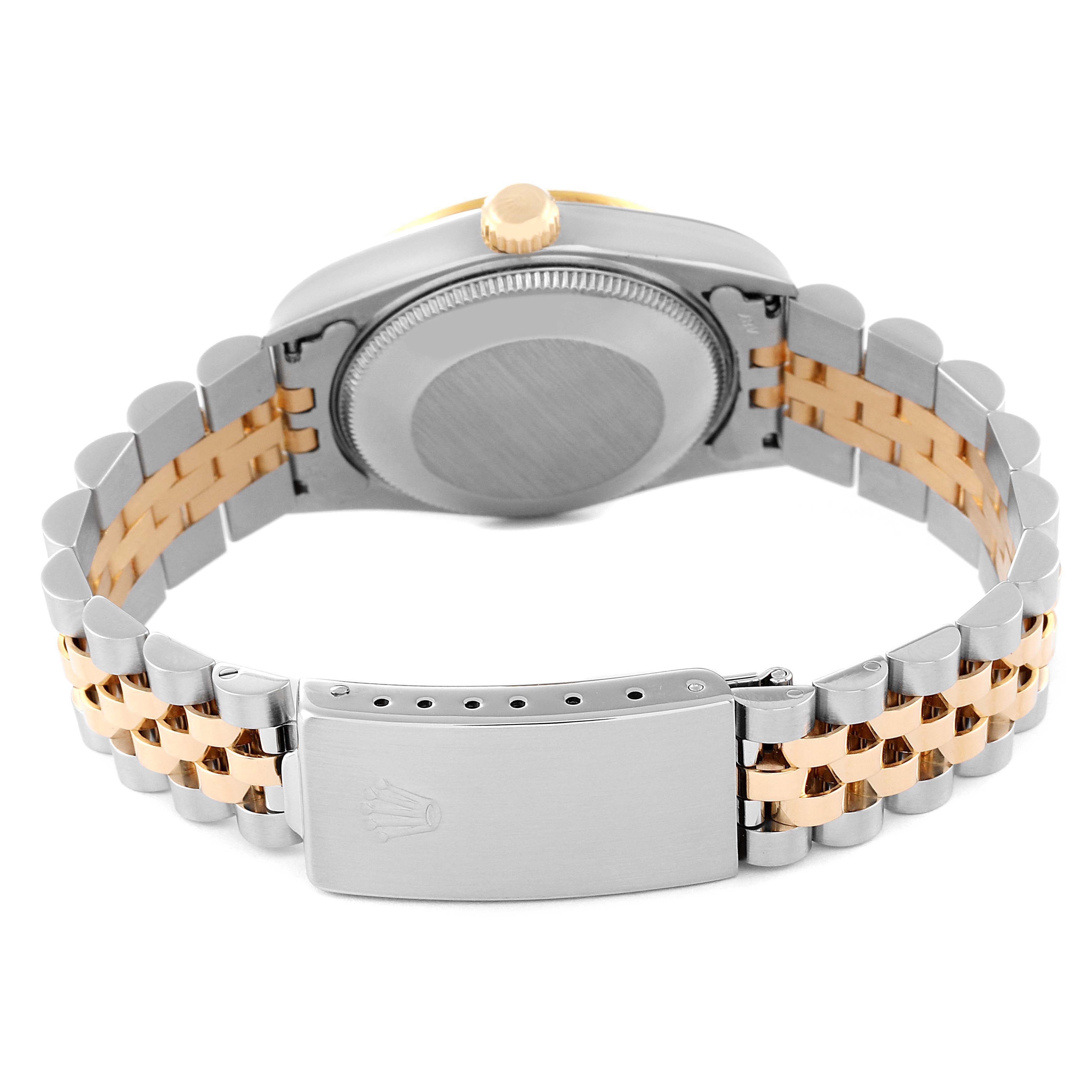 The image shows the back view of a Mid-Size Rolex watch, highlighting its case back and two-tone metal bracelet with the clasp.