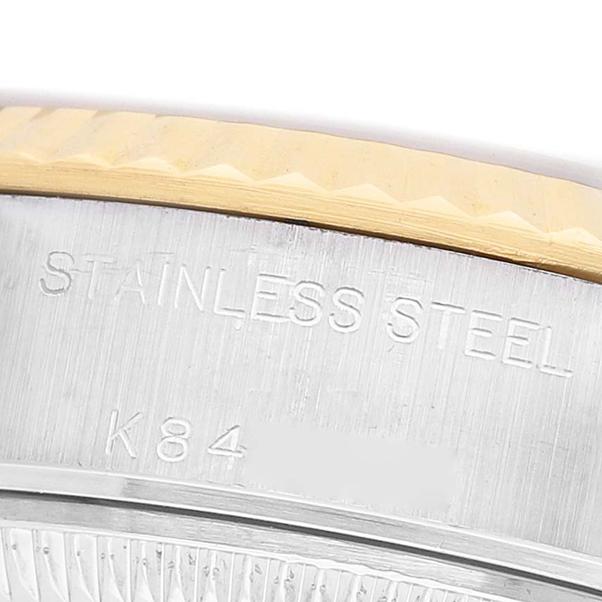 The image shows a close-up of the side of a Rolex Datejust 79173 Women's Steel and Gold (two tone) Champagne Dial watch case, highlighting the stainless steel material and part of the bezel.