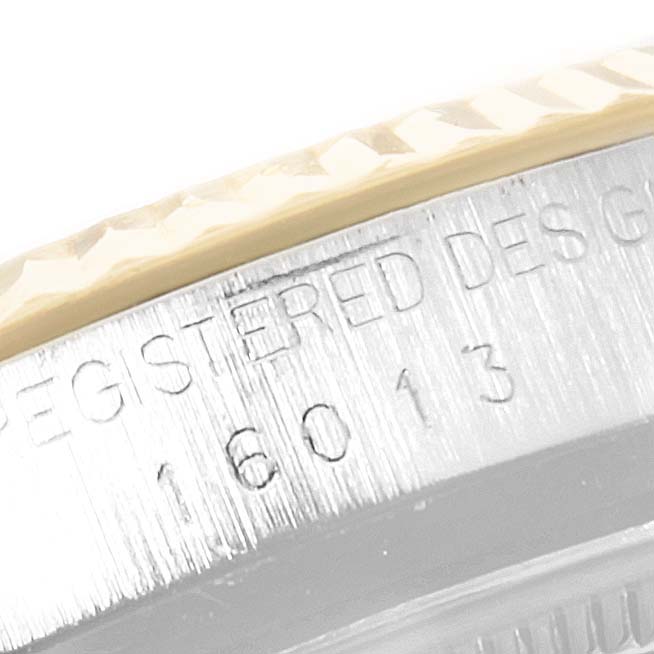 The image shows a close-up of the bezel and case edge of a Vintage Collection Rolex watch, displaying the reference number 16013.