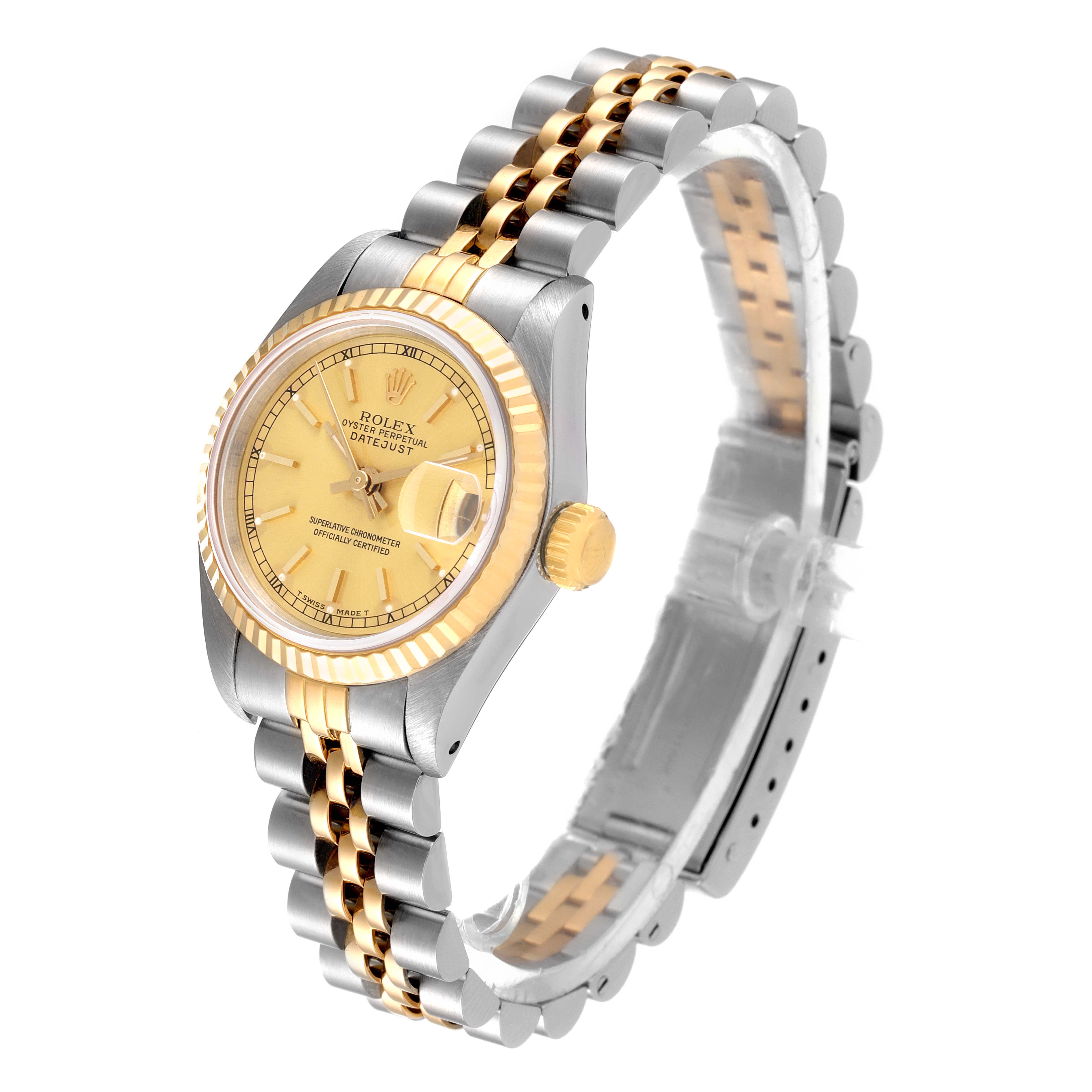 The Rolex Datejust 69173 Women
s Steel and Gold (two tone) Champagne Dial 69173 Women
s Steel and Gold (two tone) Champagne Dial watch is shown from a front-side angle, displaying its face, crown, bezel, and two-tone bracelet.