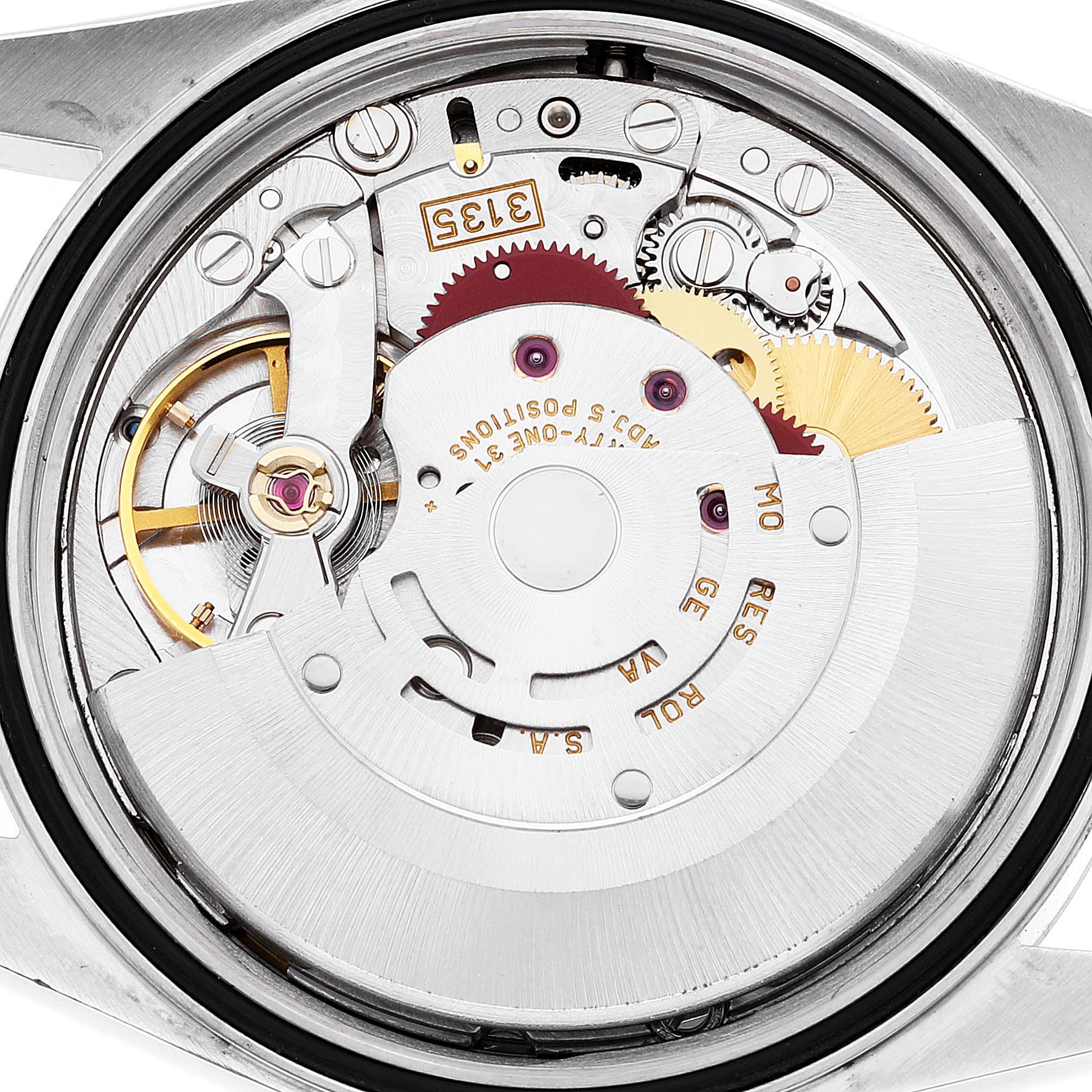 This is a close-up view of the Datejust Rolex's movement mechanism, showcasing its intricate internal components.