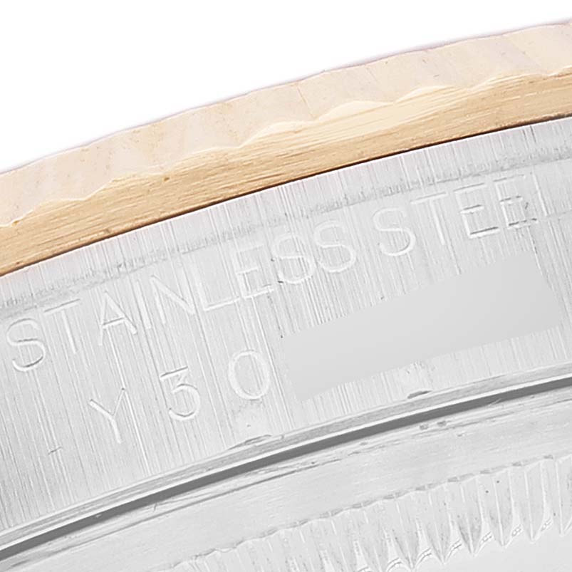 This is a close-up angle showing the stainless steel outer rim and part of the fluted bezel of a Rolex Datejust 16233 Men's Steel and Gold (two tone) Mother of Pearl Dial 16233 Men's Steel and Gold (two tone) Mother of Pearl Dial watch.