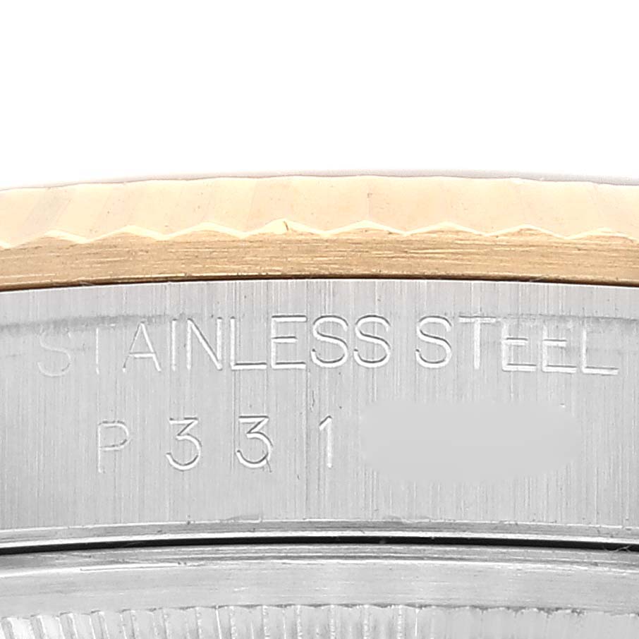 This is a close-up angle of the bezel and stainless steel part of a Rolex Datejust 16233 Men's Steel and Gold (two tone) White Dial 16233 Men's Steel and Gold (two tone) White Dial watch.