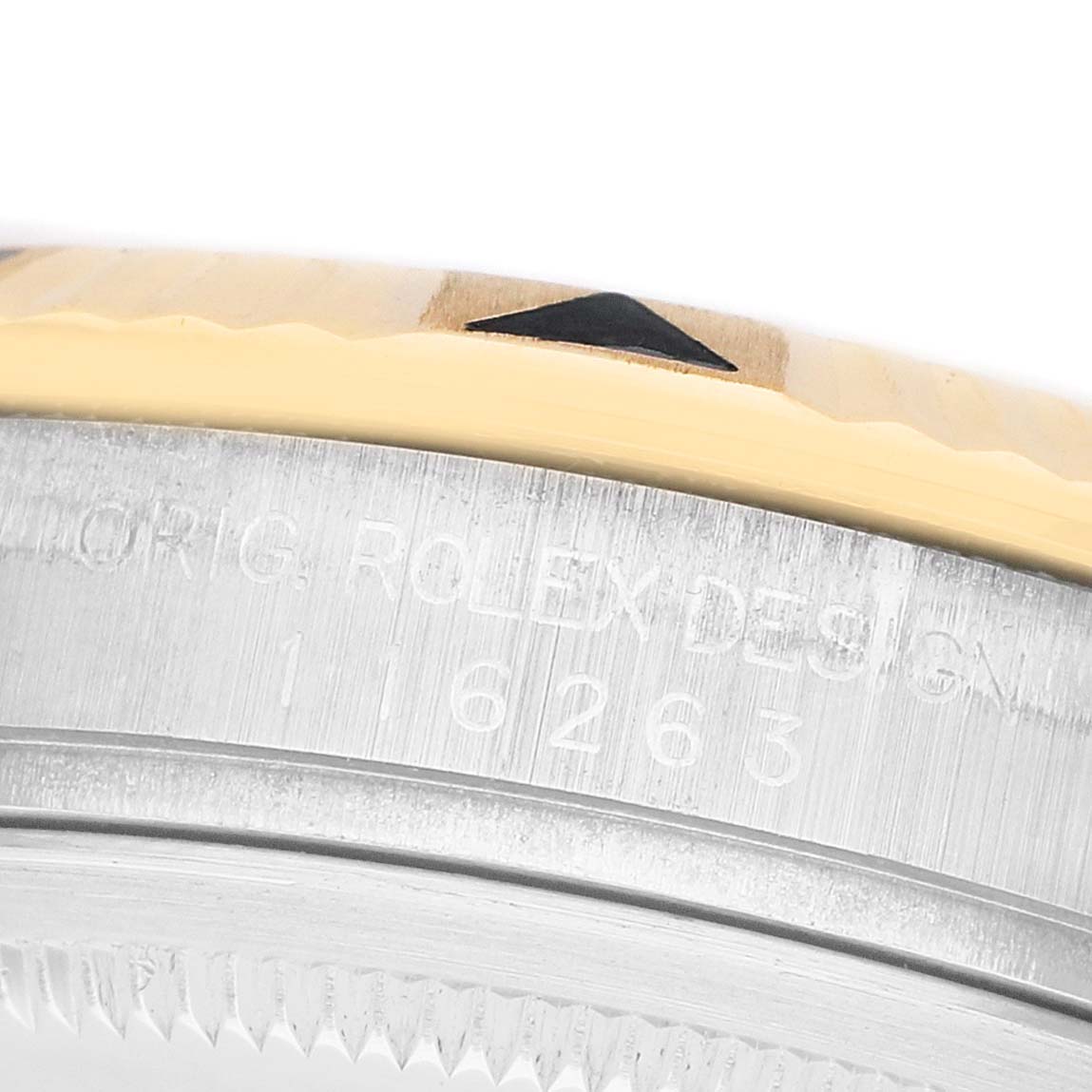 The image shows a close-up side view of the Rolex Turn-o-Graph 116263 Men's Steel and Gold (two tone) Champagne Dial model's bezel and engraved case edge.