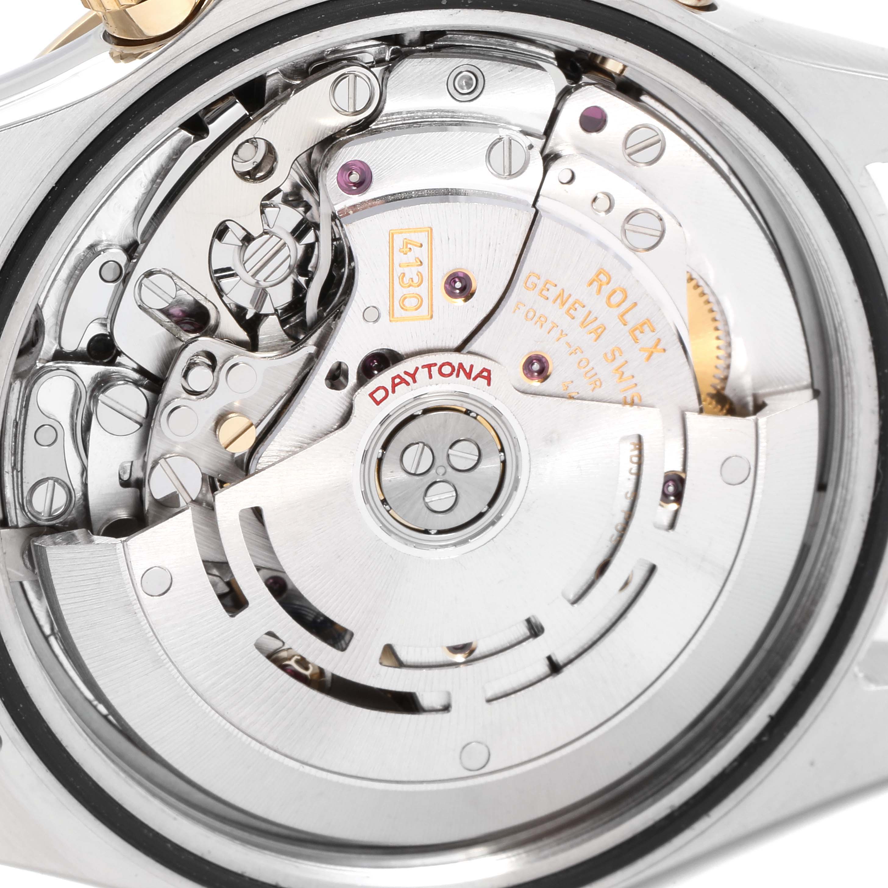 The image shows the intricate inner movement of a Rolex Daytona 116523 Men's Steel and Gold (two tone) Silver Dial 116523 Men's Steel and Gold (two tone) Silver Dial watch from a close-up angle.