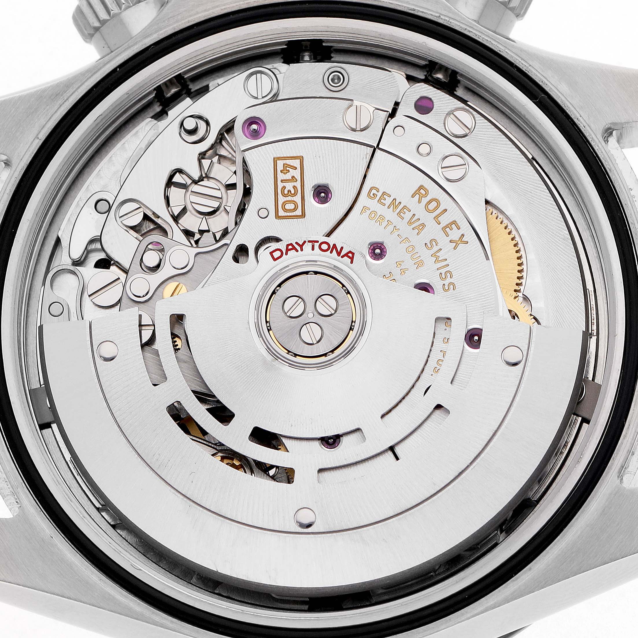 The image shows the back view of a Rolex Daytona 116500LN Men's Stainless Steel White Dial watch, highlighting the intricate mechanics and movement components.