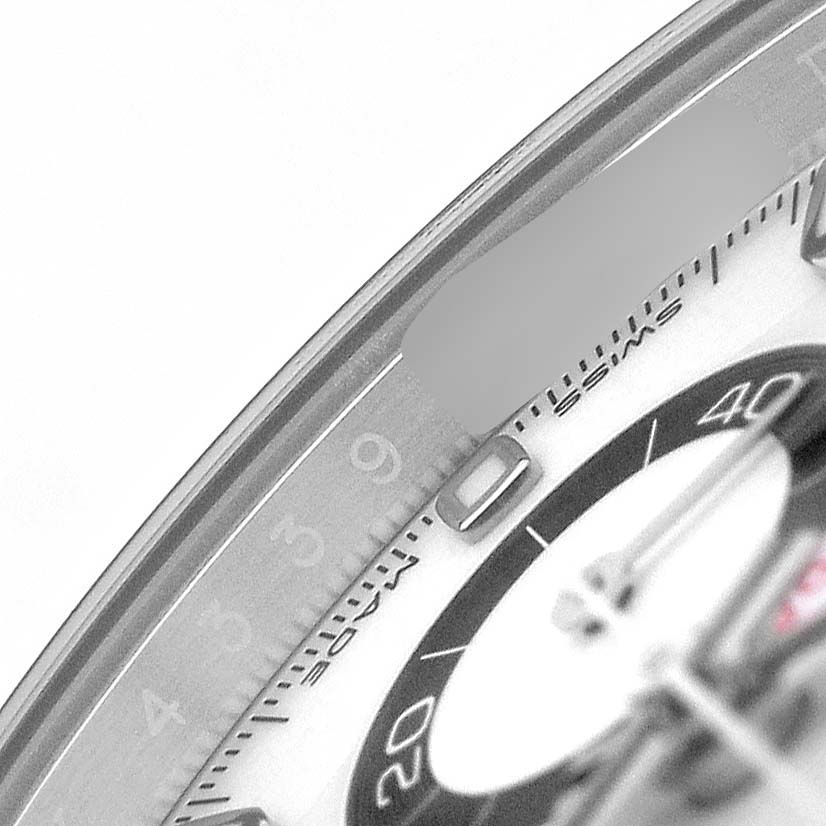 The image shows a close-up of the Rolex Daytona 116500LN Men's Stainless Steel White Dial watch face, focusing on the dial, bezel, and part of the chronograph sub-dial.