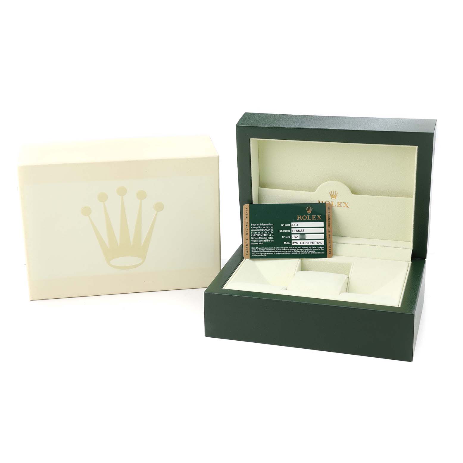The image shows the packaging and warranty card for a Rolex Daytona 116523 Men's Steel and Gold (two tone) Black Dial, including an open green box and an outer cream box.