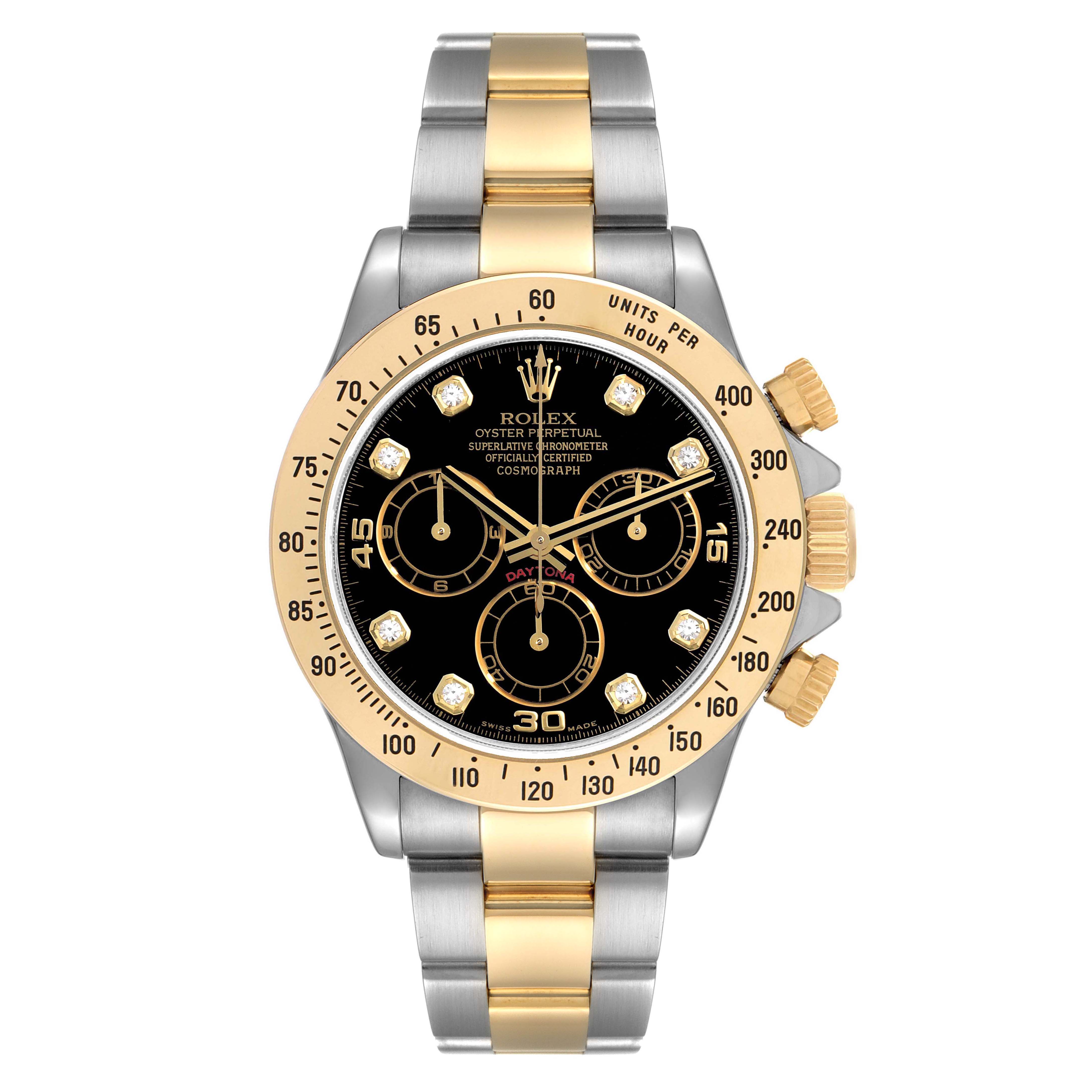The image shows a front view of a Rolex Daytona 116523 Men
s Steel and Gold (two tone) Black Dial 116523 Men
s Steel and Gold (two tone) Black Dial watch, featuring a black dial, gold bezel, gold and silver band, and three subdials.