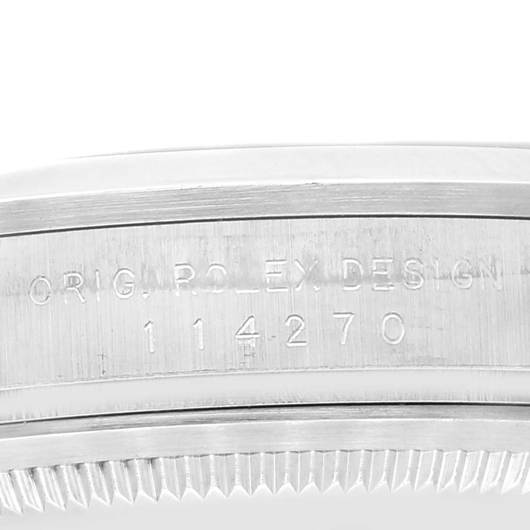 The image shows a close-up of the case side engraving of a Rolex Explorer 114270 Men
s Stainless Steel Black Dial 114270 Men
s Stainless Steel Black Dial watch, model number 114270.