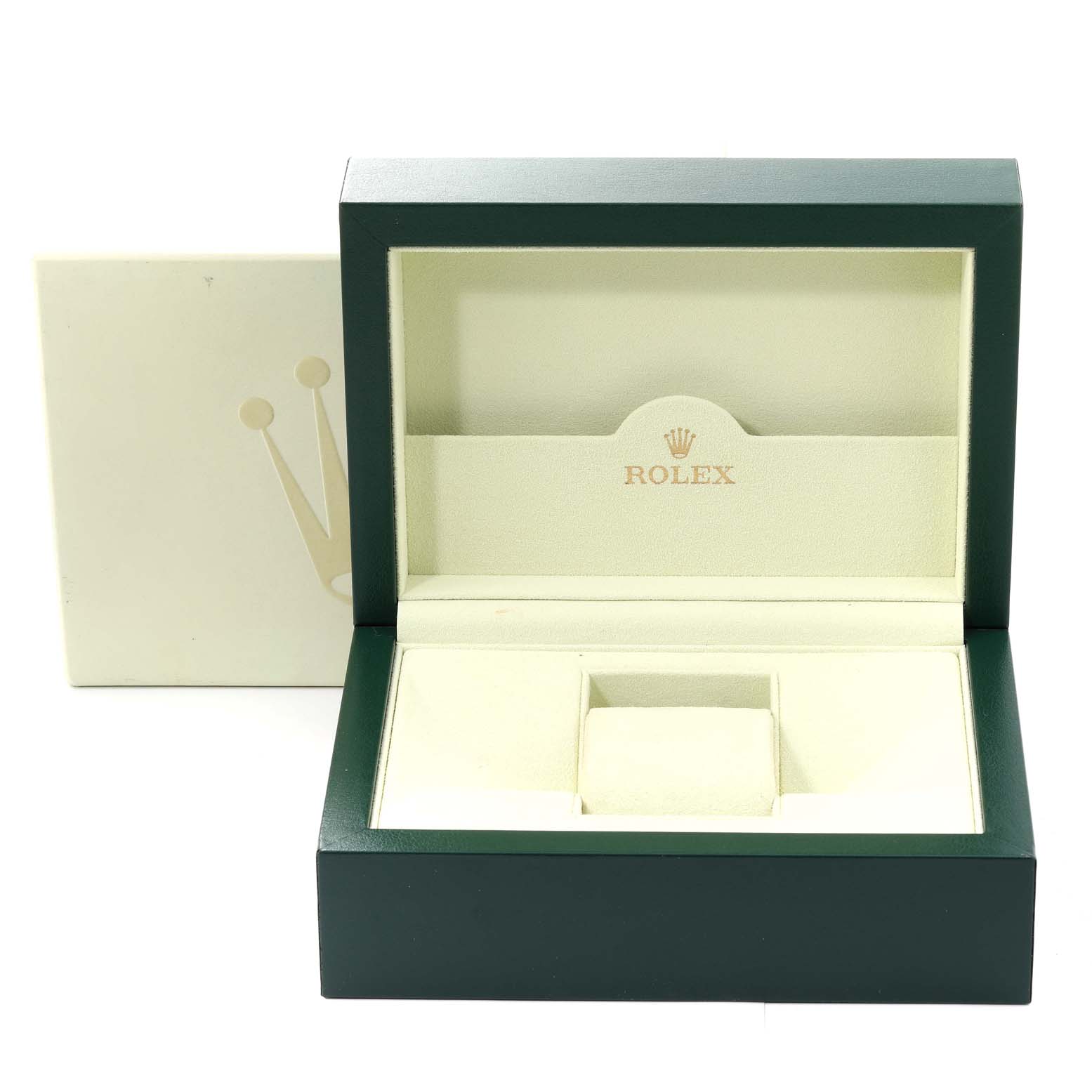 This image shows an open green and beige Rolex box, presumably for the Explorer model watch.