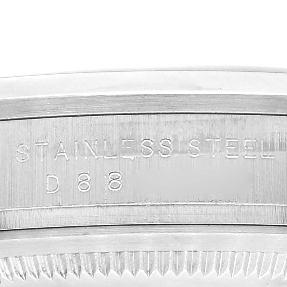 This image shows a close-up of the stainless steel bezel and caseback rim of a Rolex Explorer 114270 Men
s Stainless Steel Black Dial 114270 Men
s Stainless Steel Black Dial watch.