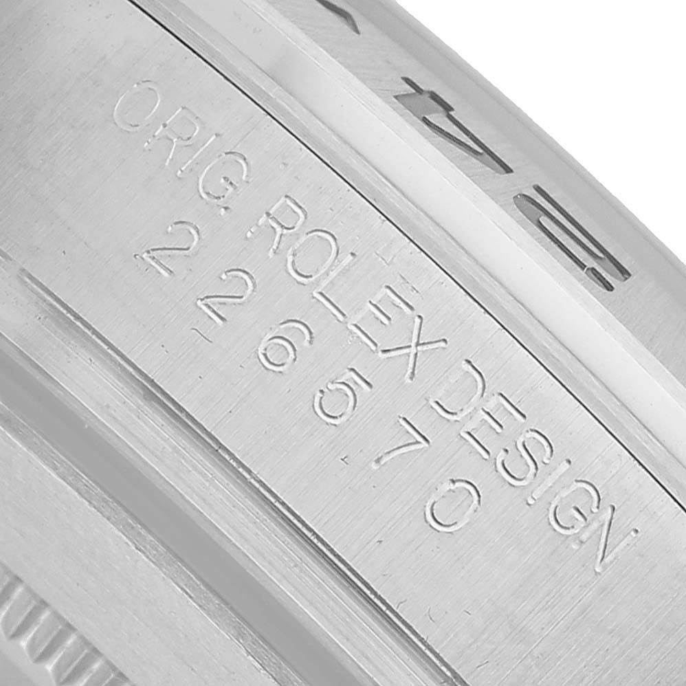 The image shows a close-up of the side engraving on the bezel of a Rolex Explorer 226570 Men's Stainless Steel Black Dial watch.