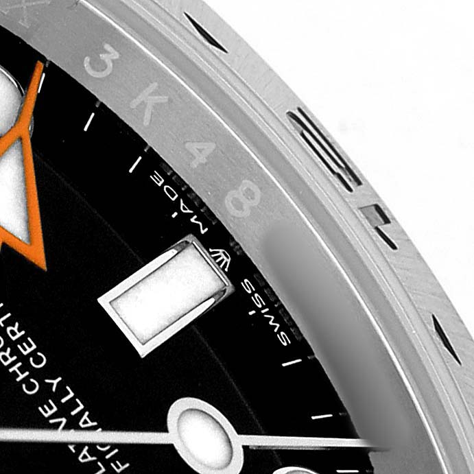 The image shows a close-up of the dial and bezel of a Rolex Explorer 226570 Men's Stainless Steel Black Dial, highlighting the markers and a portion of the hands.