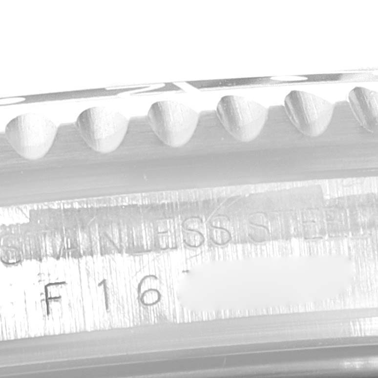 This image shows a close-up of the engraved stainless steel case and the bezel edge of a Rolex GMT-Master 16710 Men
s Stainless Steel Black Dial 16710 Men
s Stainless Steel Black Dial watch.