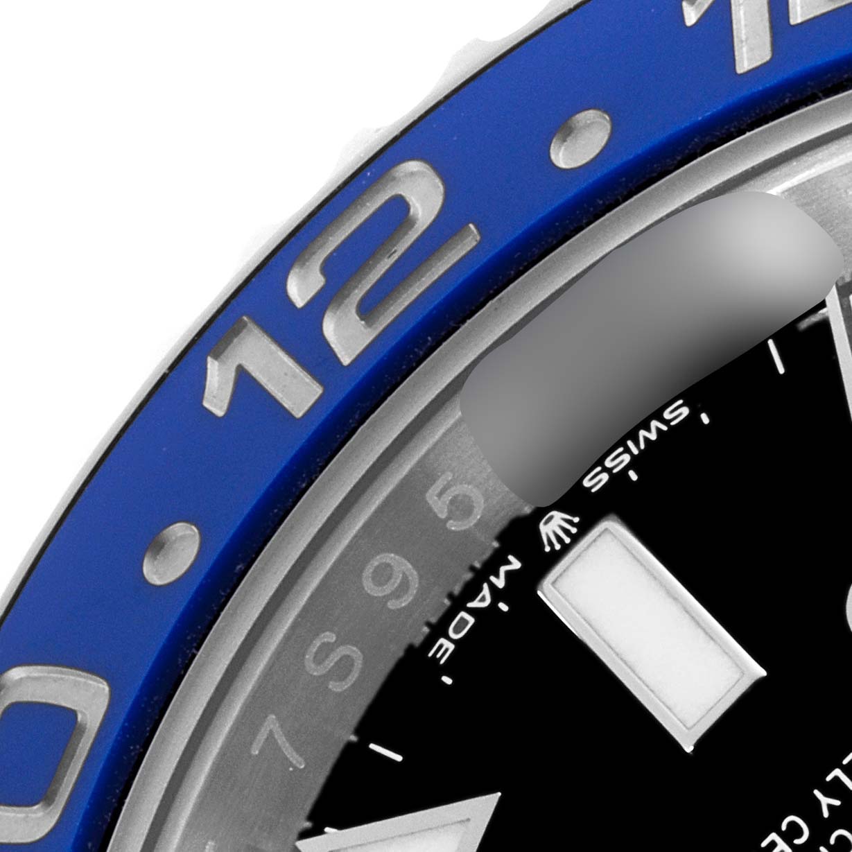 This image shows a close-up of the bezel and partial dial of a Rolex GMT-Master 126710BLNR Men
s Stainless Steel Black Dial 126710BLNR Men
s Stainless Steel Black Dial watch with a blue color.