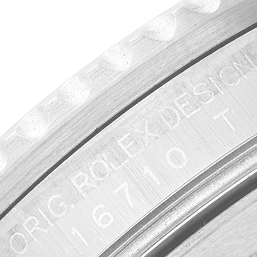 This close-up image shows the engraved bezel and caseback of a Rolex GMT-Master 16710 Men
s Stainless Steel Black Dial 16710 Men
s Stainless Steel Black Dial model.