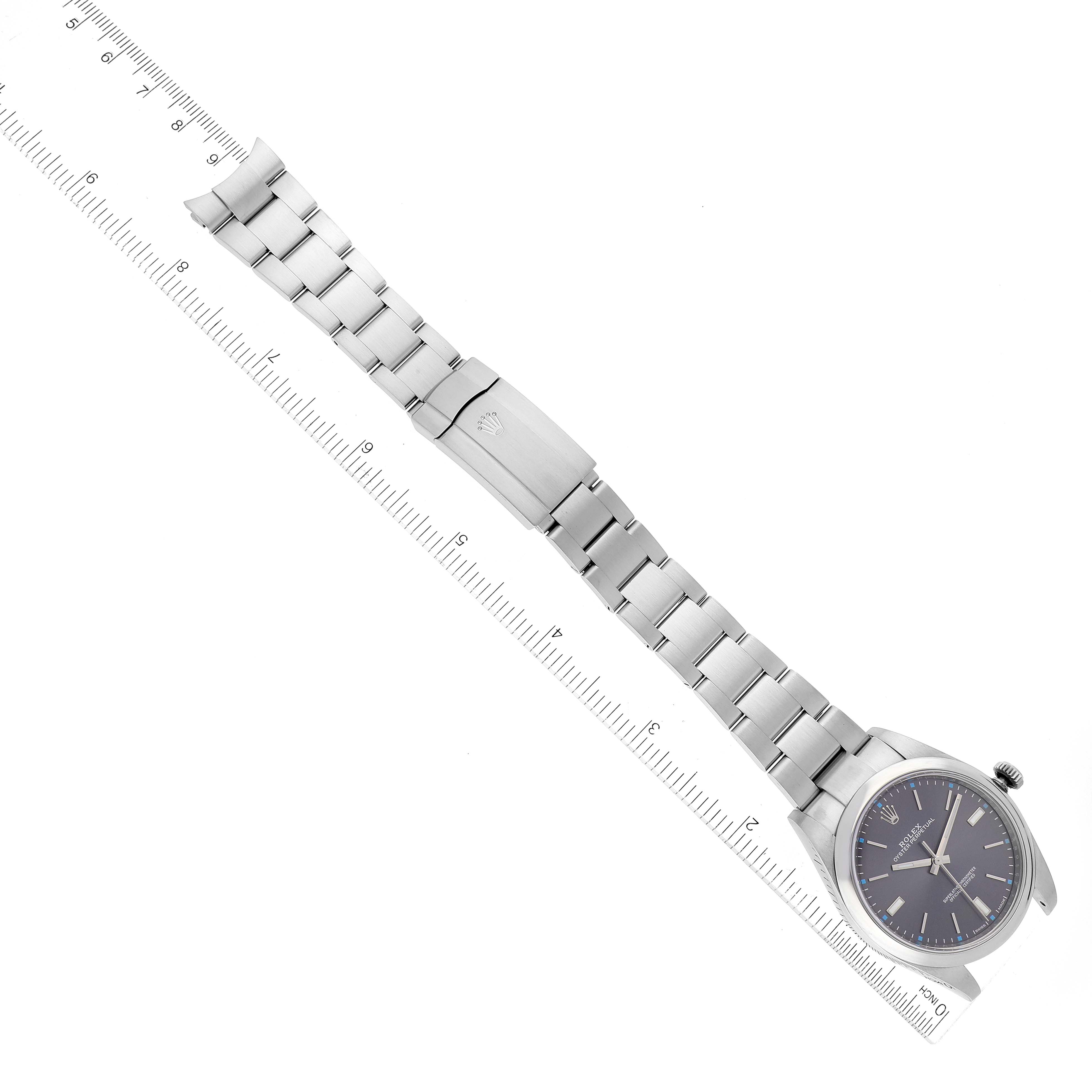 The image shows a top-down view of a Rolex Oyster Perpetual 114300 Men
s Stainless Steel Grey Dial 114300 Men
s Stainless Steel Grey Dial watch, displaying its face, bracelet, and clasp.