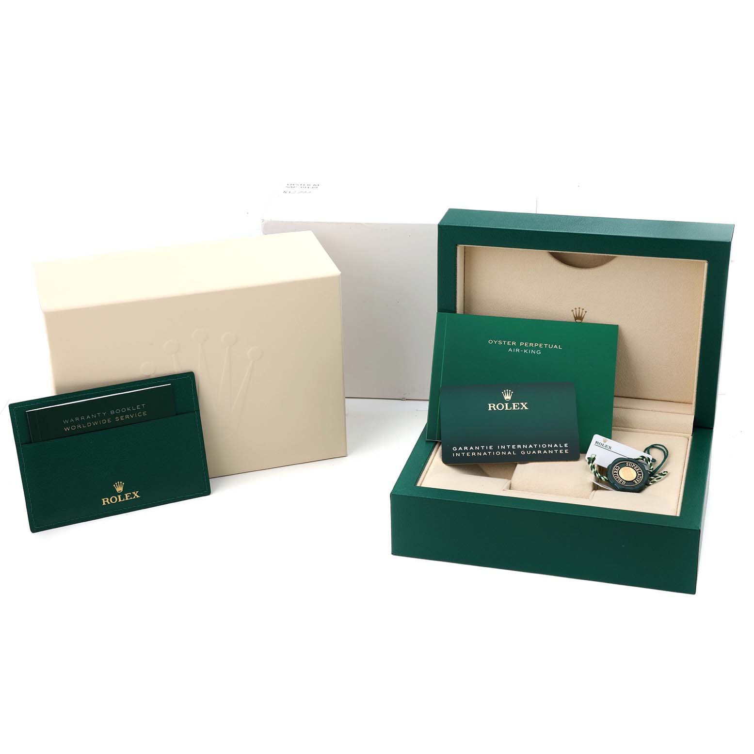 The image shows the packaging, warranty booklet, and tags for the Rolex Air-King 126900 Men's Stainless Steel Black Dial, without the watch present.