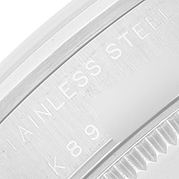 The image shows a close-up of the stainless steel back casing of a Rolex Mid-Size 77080 Women
s Stainless Steel Pink Dial 77080 Women
s Stainless Steel Pink Dial watch.