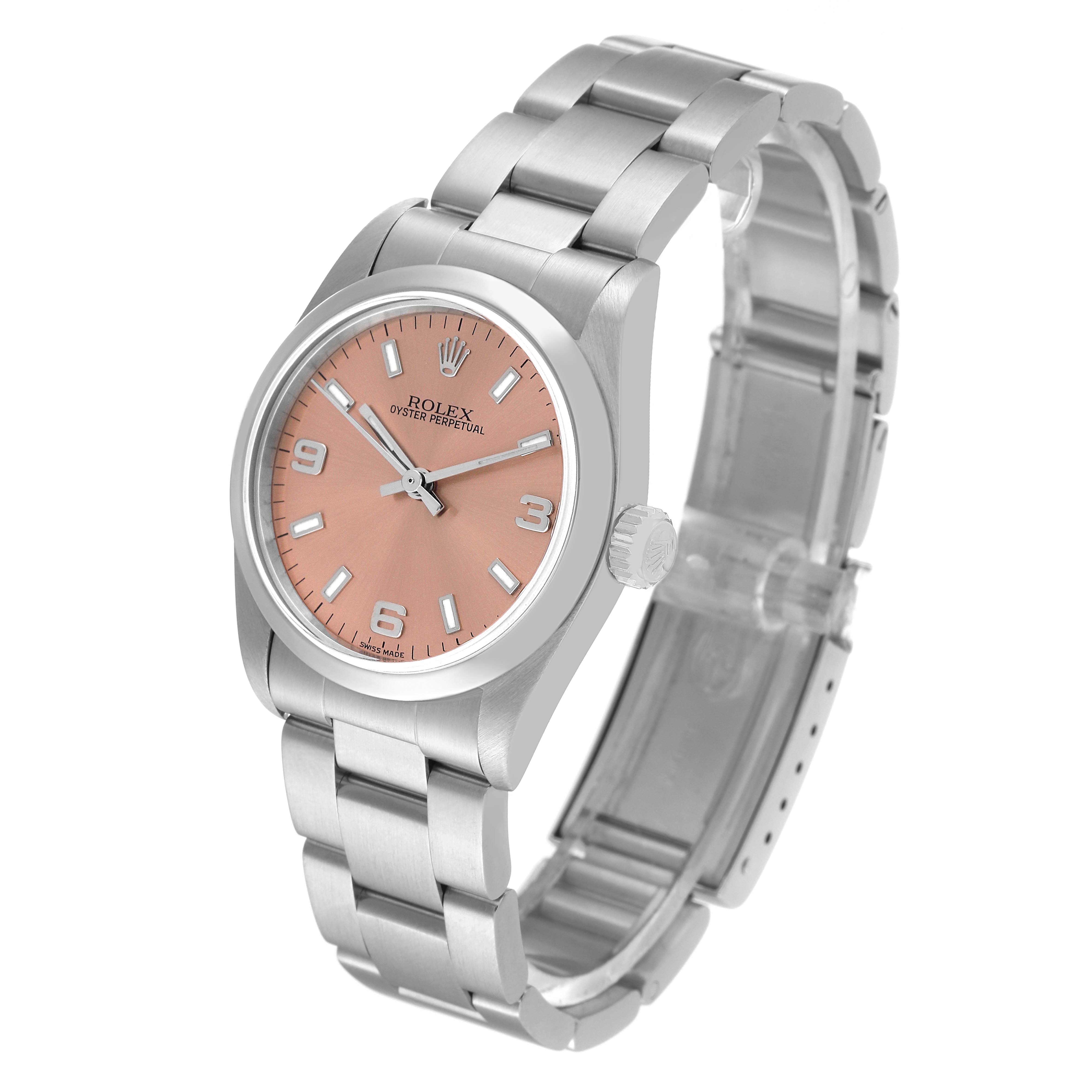 The Rolex Mid-Size 77080 Women
s Stainless Steel Pink Dial 77080 Women
s Stainless Steel Pink Dial Oyster Perpetual watch is shown at an angled view displaying its pink dial, silver bracelet, and crown.