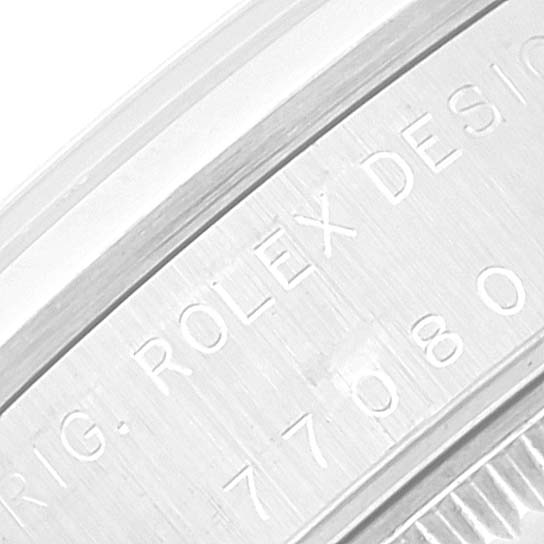 This close-up image shows the engraved details on the side of a Mid-Size Rolex watch case.