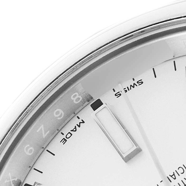 This close-up shows part of the dial with numerals and markers of a Rolex Oyster Perpetual 114200 Men's Stainless Steel White Dial 114200 Men's Stainless Steel White Dial watch.