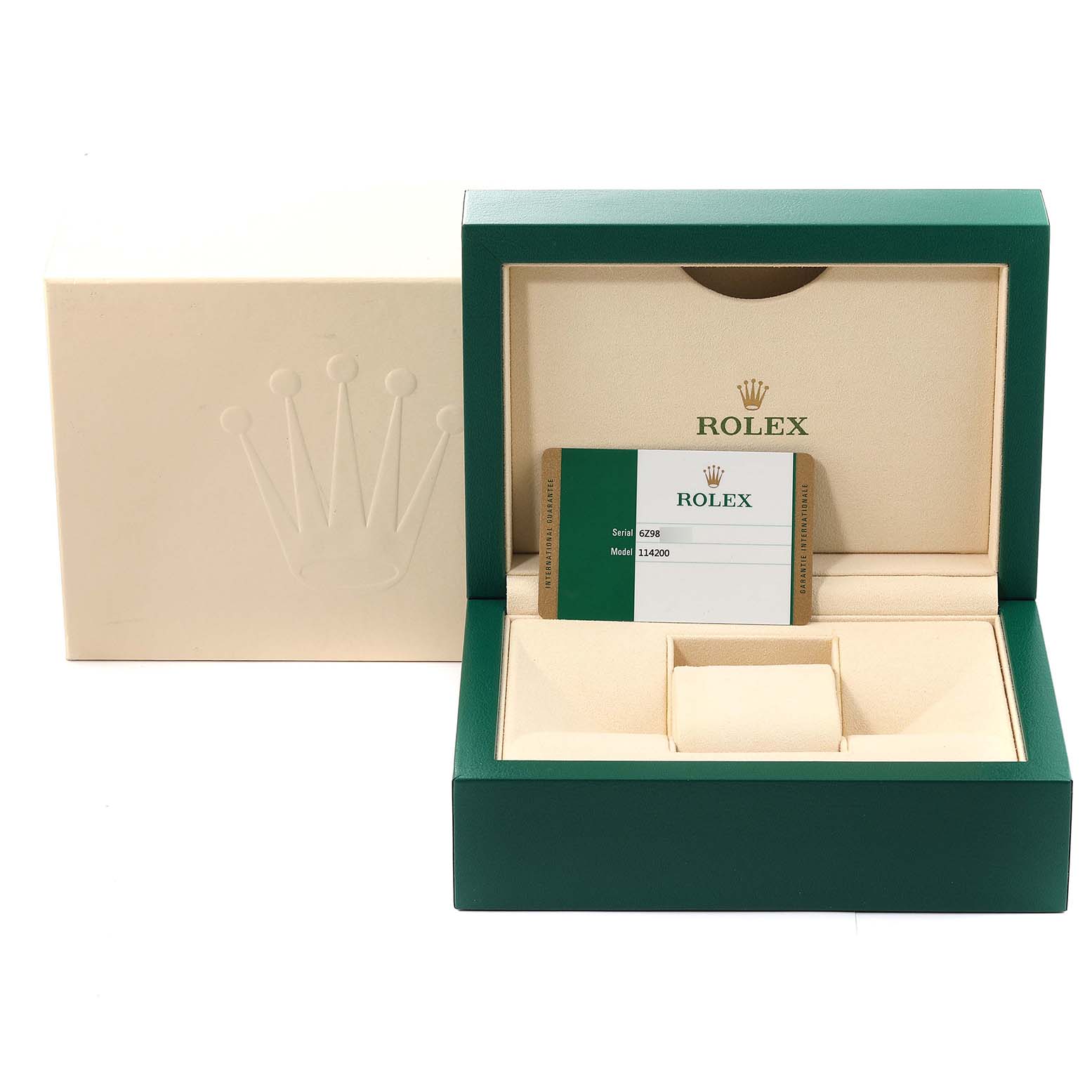 The image shows the packaging and certification card of an Oyster Perpetual Rolex watch.
