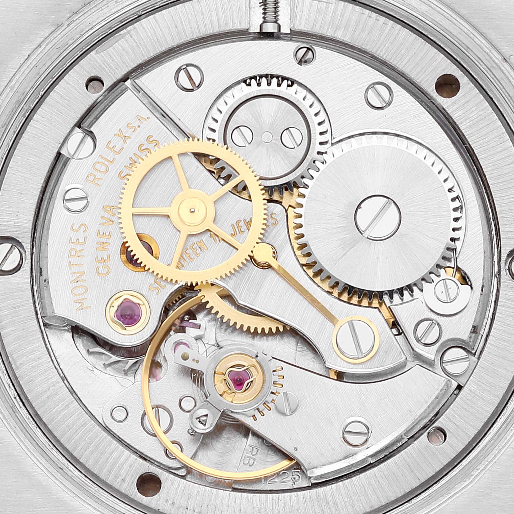 The image shows a close-up of the intricate inner mechanical workings of a Rolex Vintage Collection 6694 Men's Stainless Steel Silver Dial 6694 Men's Stainless Steel Silver Dial watch.