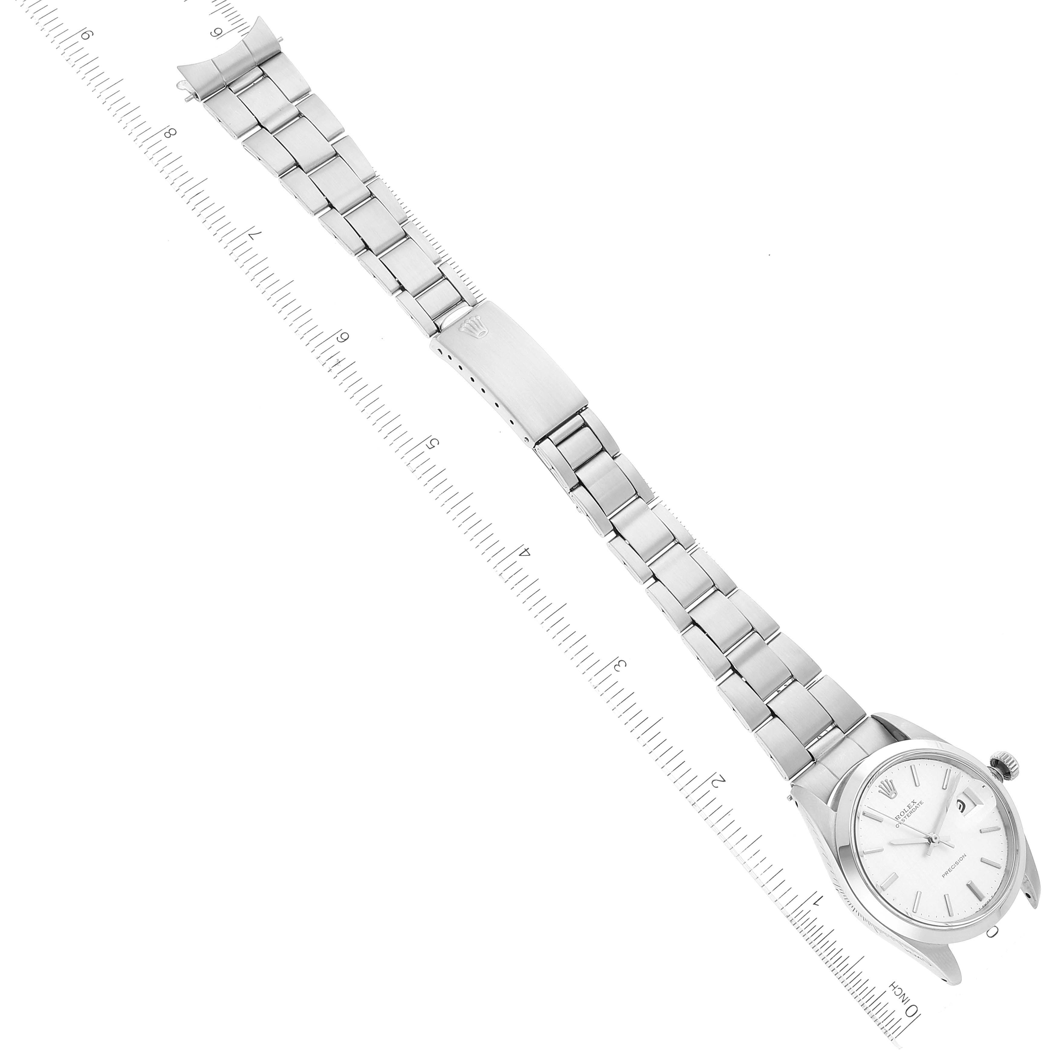 The image shows a Rolex Vintage Collection 6694 Men's Stainless Steel Silver Dial 6694 Men's Stainless Steel Silver Dial model watch photographed from an overhead angle, showcasing the full bracelet and watch face.