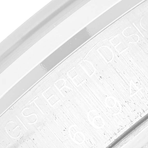 The image shows an angled view of the side inscription on a vintage Rolex Vintage Collection 6694 Men's Stainless Steel Silver Dial 6694 Men's Stainless Steel Silver Dial model watch.