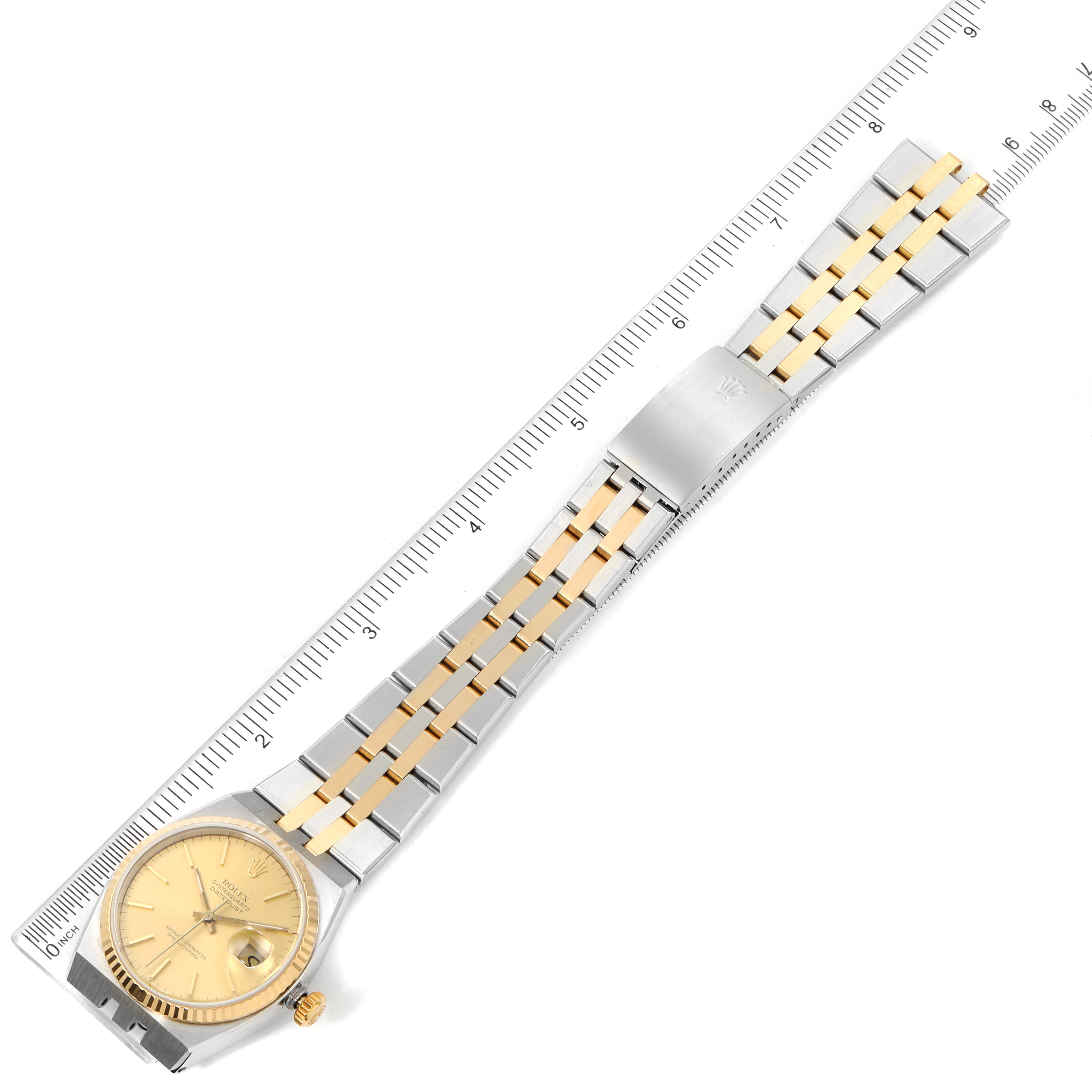 The image shows a top-down view of a Rolex Oysterquartz 17013 Men's Steel and Gold (two tone) Champagne Dial 17013 Men's Steel and Gold (two tone) Champagne Dial watch displaying the full length of the bracelet and dial with rulers for measurement.