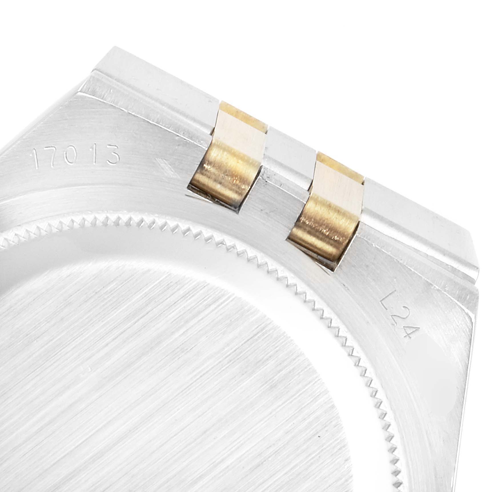 This is a close-up angle of the Rolex Oysterquartz 17013 Men's Steel and Gold (two tone) Champagne Dial 17013 Men's Steel and Gold (two tone) Champagne Dial's case edge and part of the bracelet attachment.