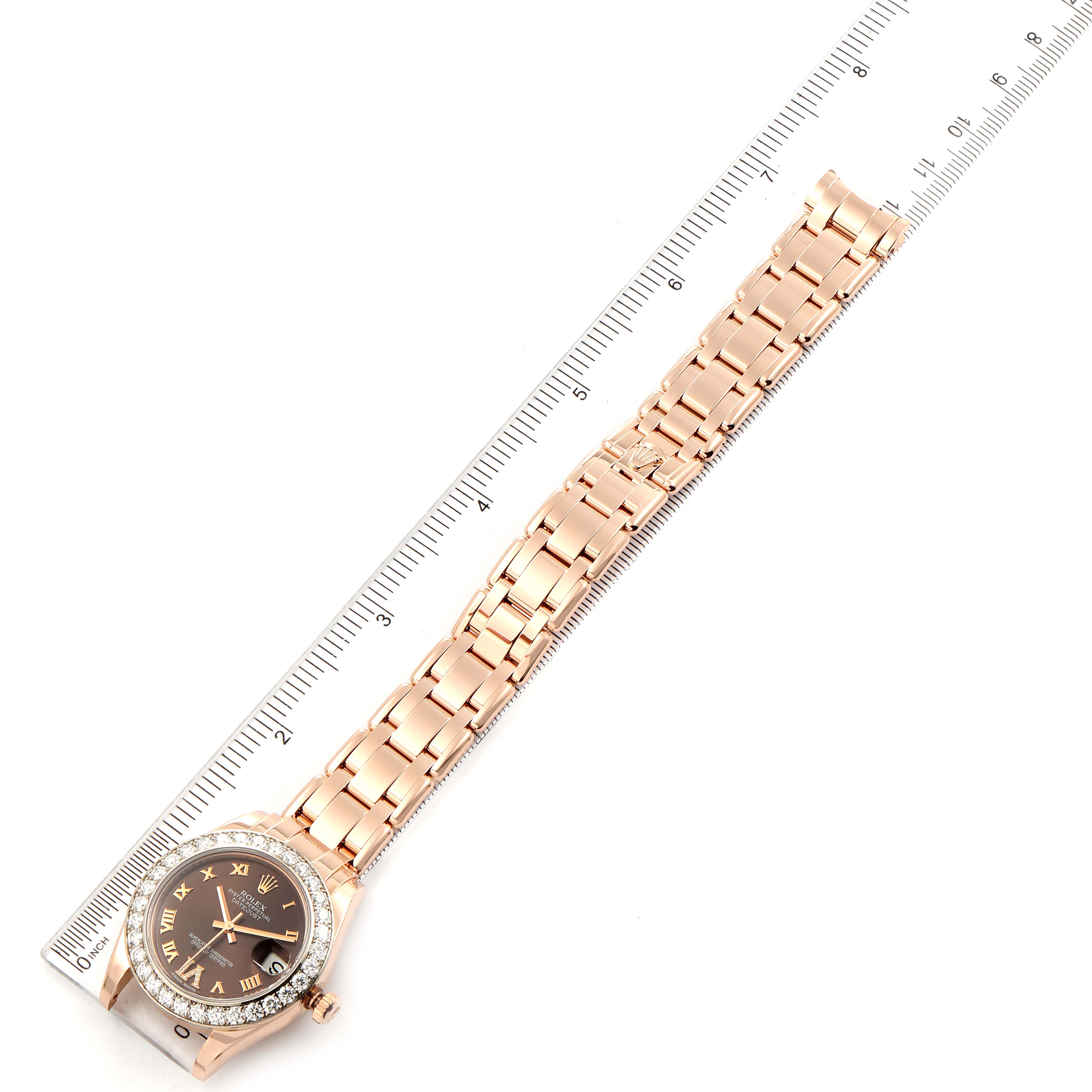 The image shows a Rolex Pearlmaster 81285 Women's Rose Gold Brown Dial 81285 Women's Rose Gold Brown Dial watch laid flat next to a ruler, displaying the entire bracelet and face from an overhead angle.