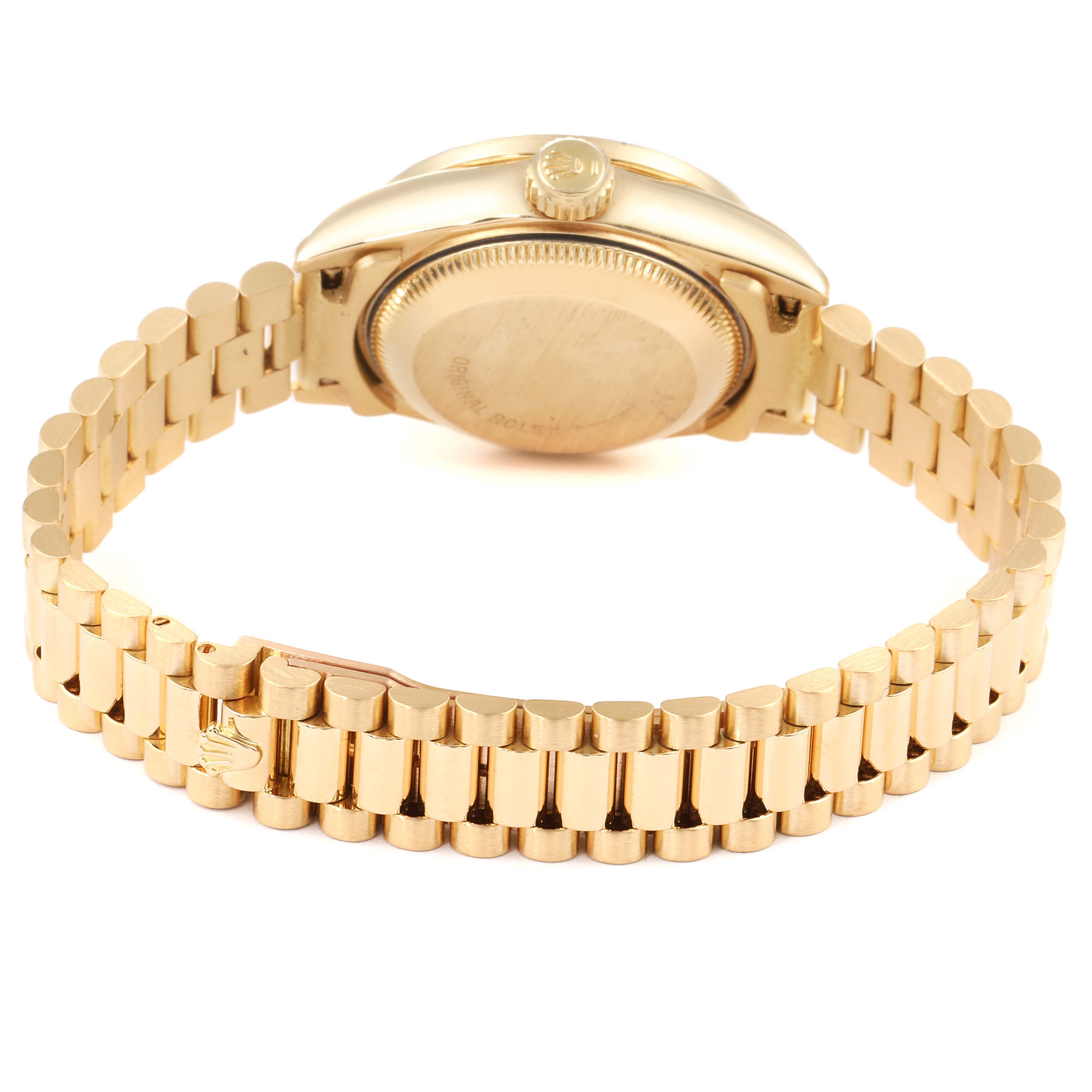 This image shows the back view of a Rolex President 69138 Women's Yellow Gold Champagne Dial 69138 Women's Yellow Gold Champagne Dial model watch, highlighting the case back, crown, and bracelet.