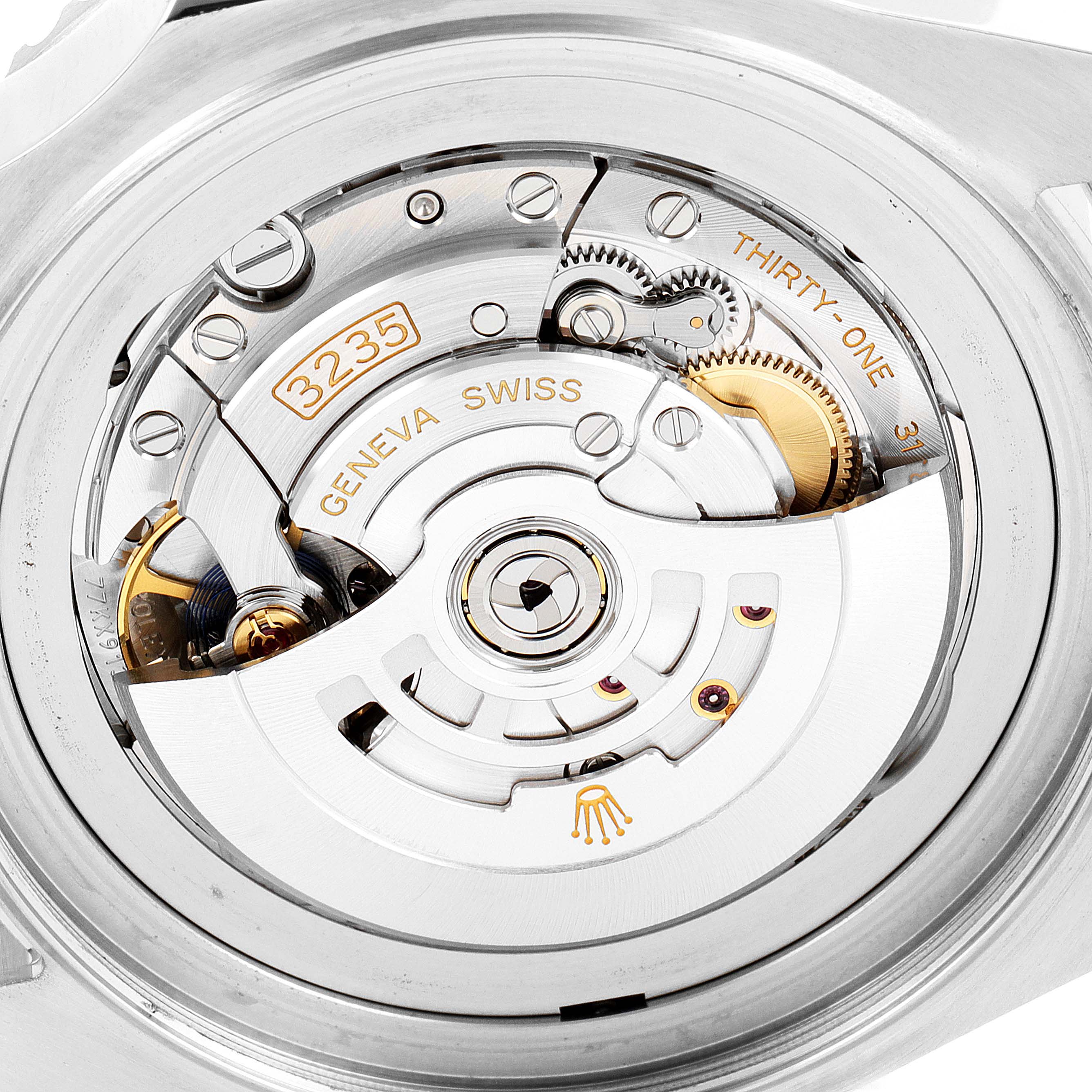 The image shows the movement mechanism of a Rolex Sea-Dweller 126660 Men's Stainless Steel Blue Dial 126660 Men's Stainless Steel Blue Dial watch from a rear angle, highlighting the intricate components and engravings.