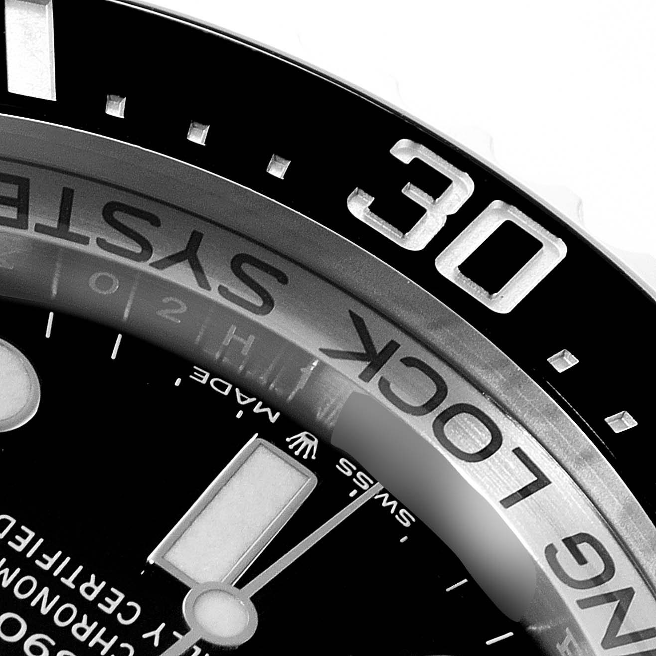 This image shows a close-up angle of the bezel and part of the dial of a Rolex Sea-Dweller 126660 Men's Stainless Steel Blue Dial 126660 Men's Stainless Steel Blue Dial watch.
